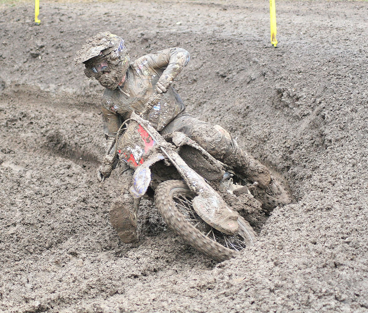 Covered head to toe in mud, Jeremy Martin keeps his eyes on the prize.