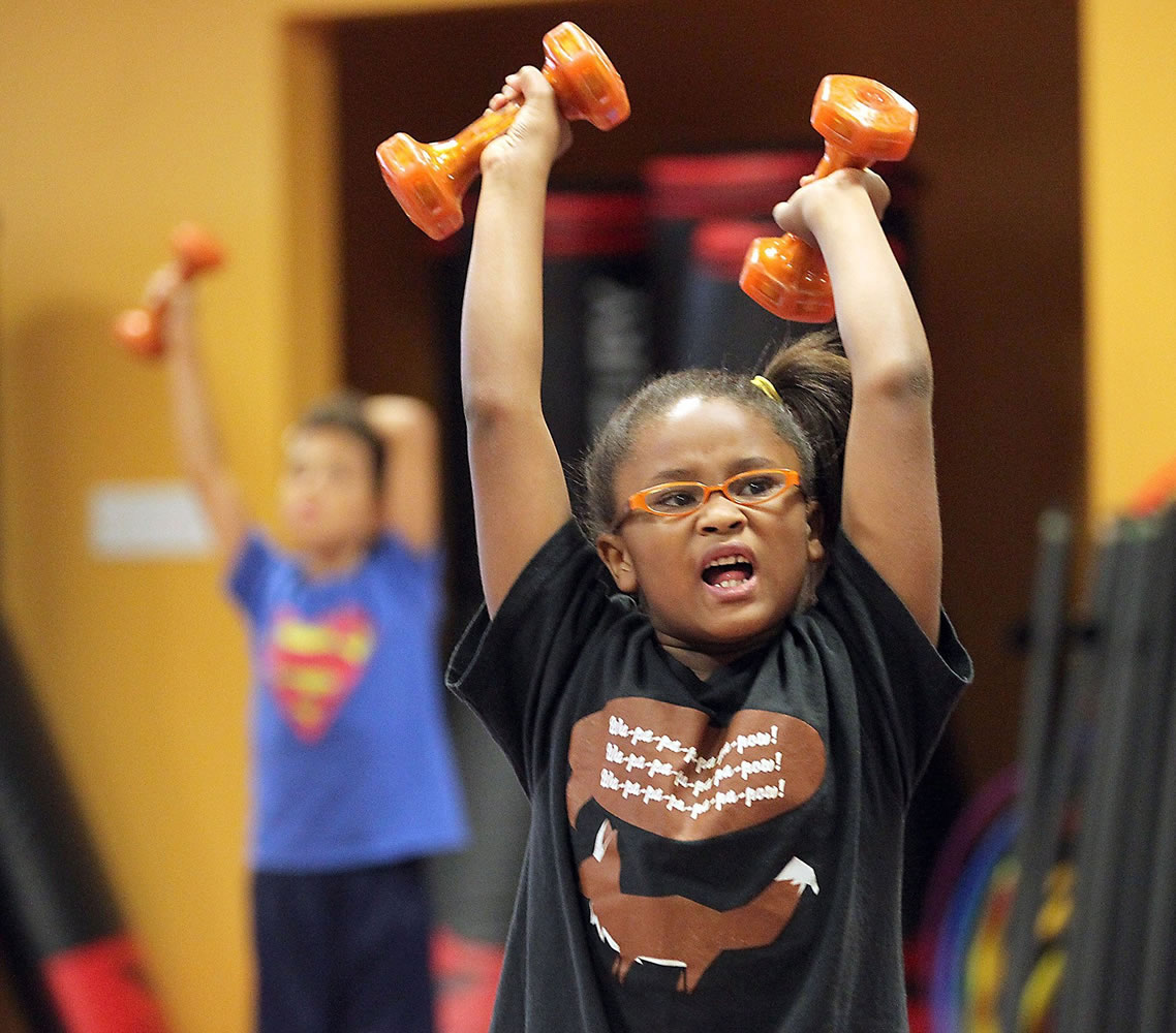 Nikki Smith 7, works out during Ricky Dickerson's fitness class July 14 at Memorial West Hospital in Pembroke Pines, Fla., a boot camp for kids to help them stay active and healthy.