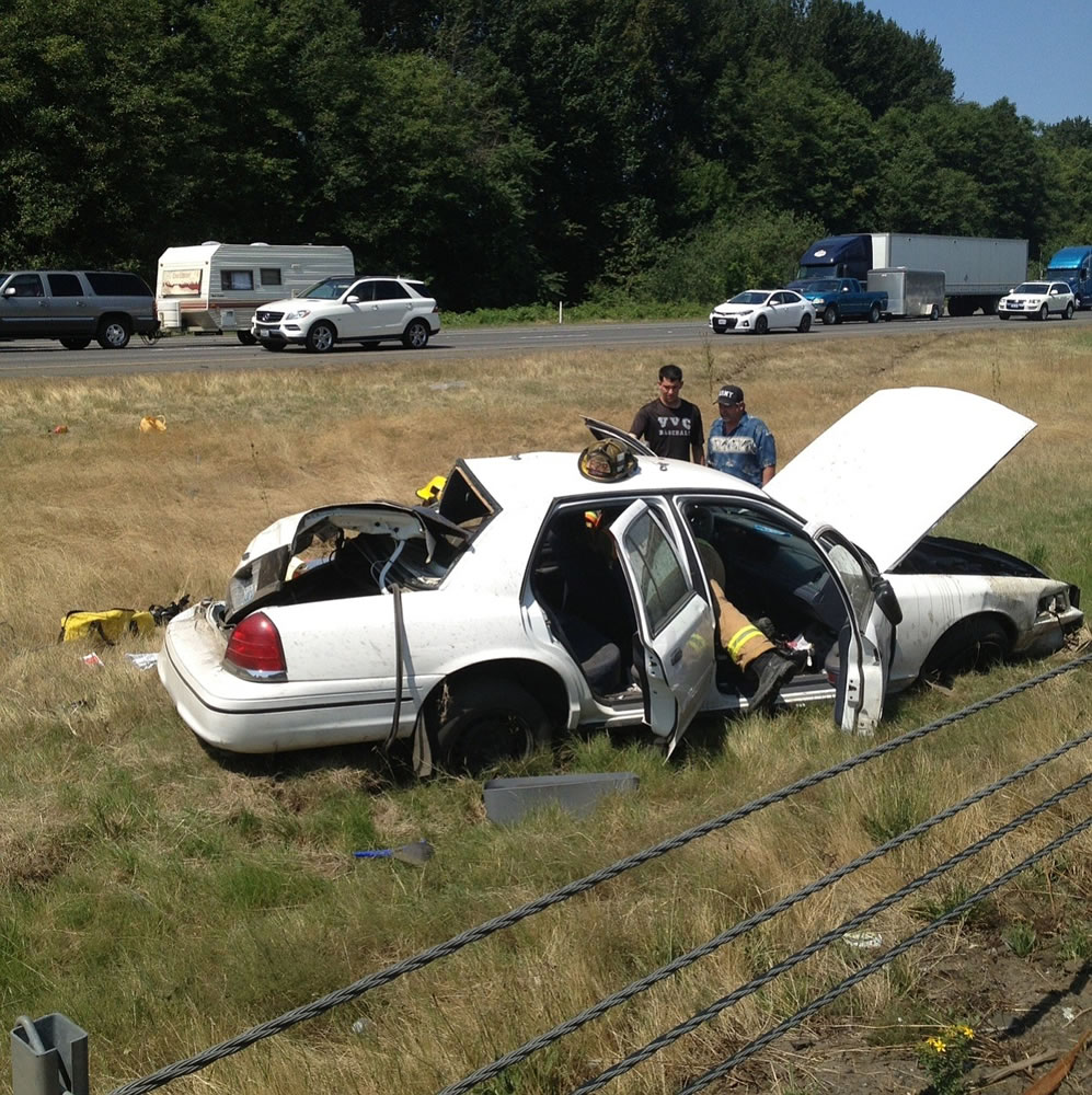 A car left interstate 5 south and rolled several times, landing in the grassy median near the northbound lanes.