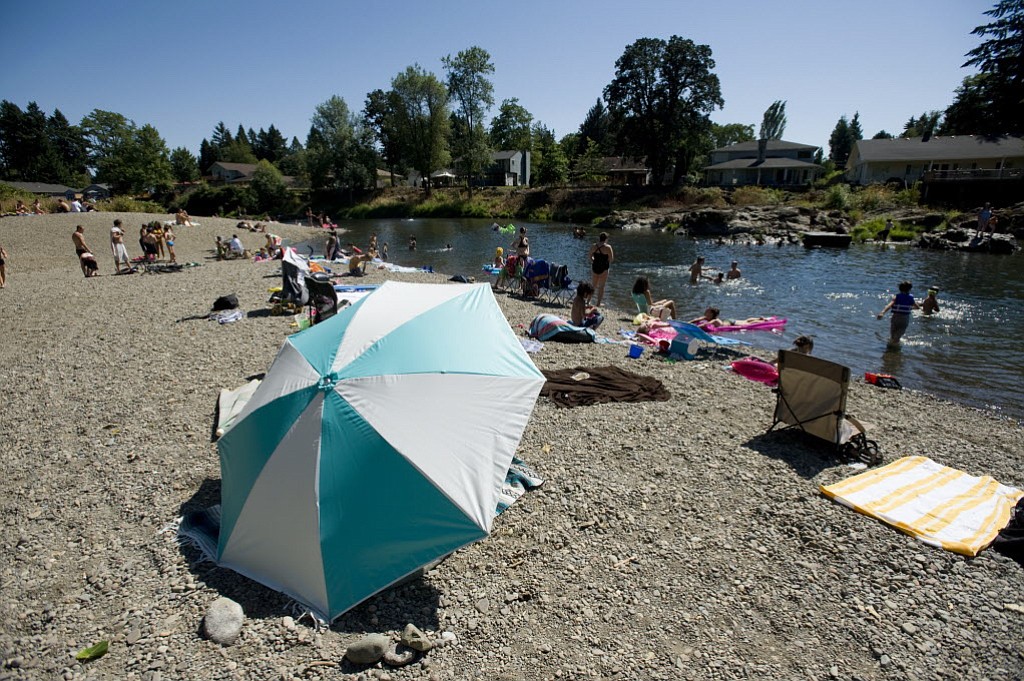 Swimmers flock to Sandy Swimming Hole on the Washougal River in 2010.