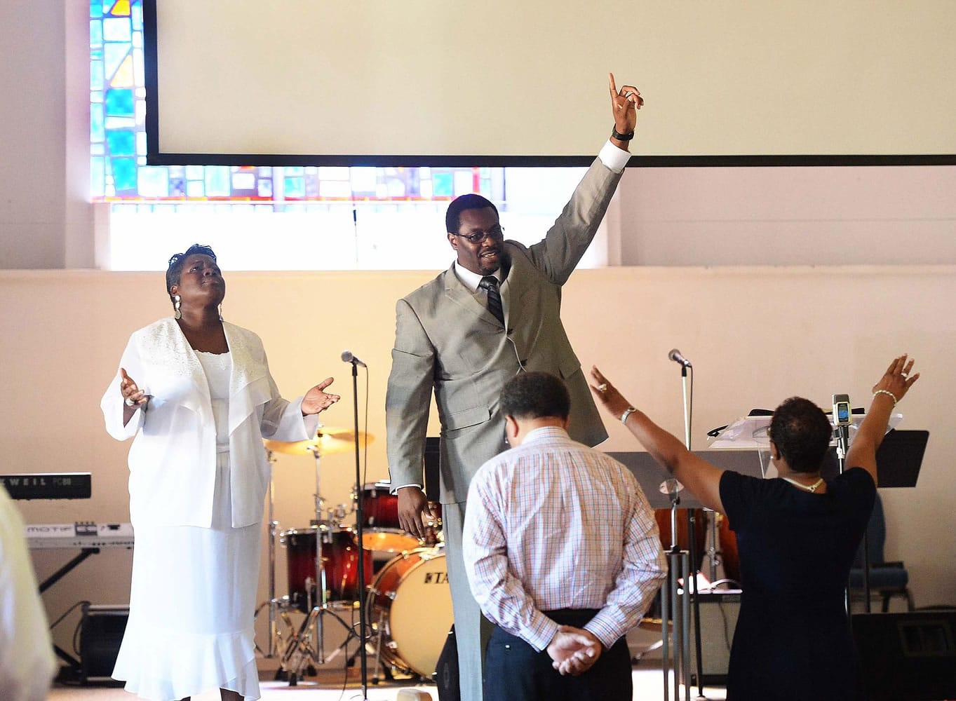 Co-pastor Rhonda Kinsey, left, and her husband, senior pastor Mannix Kinsey, lead the congregation during the 11 a.m. Sunday service at Briar Creek Road Baptist Church on June 28 in Charlotte, N.C.