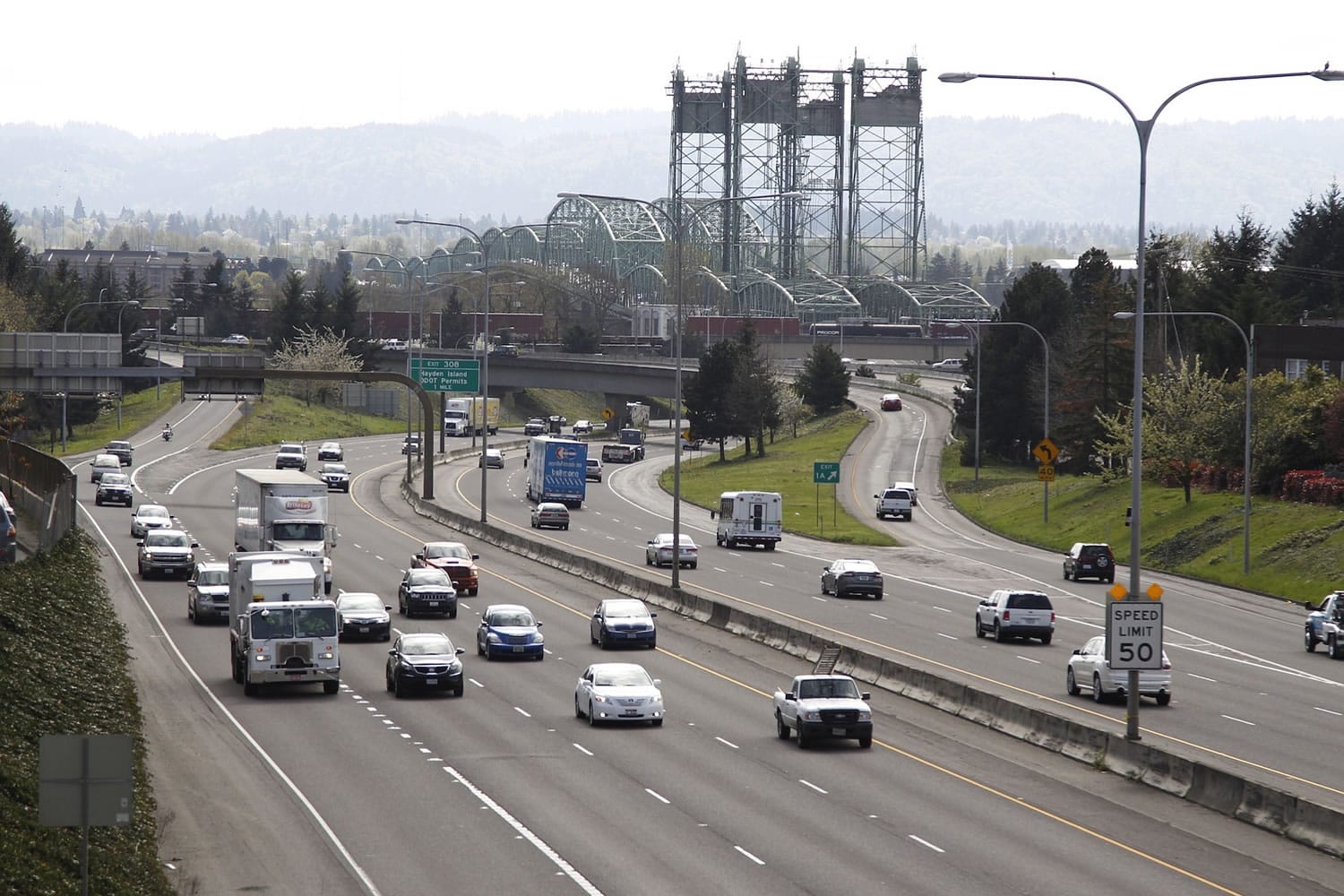 Traffic moves along I-5 near the Interstate Bridge, seen from the Evergreen Boulevard overpass.