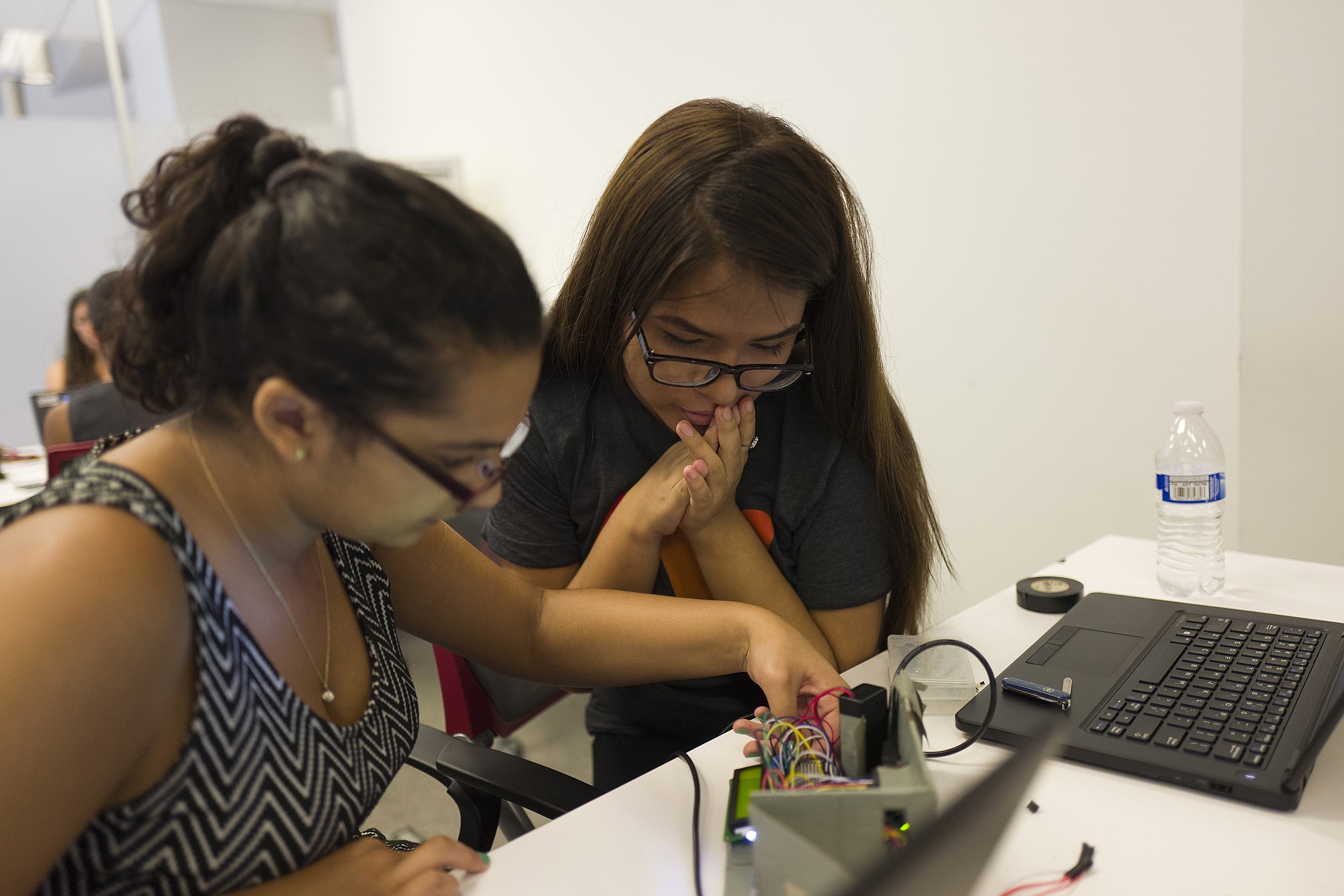 Nikki Kahn/The Washington Post
India Bhalla-Ladd, 15, left, and Stephanie Villanueva, 17, work on their product, Plantech, during the Girls Who Code Summer Immersion Program at Georgetown University.