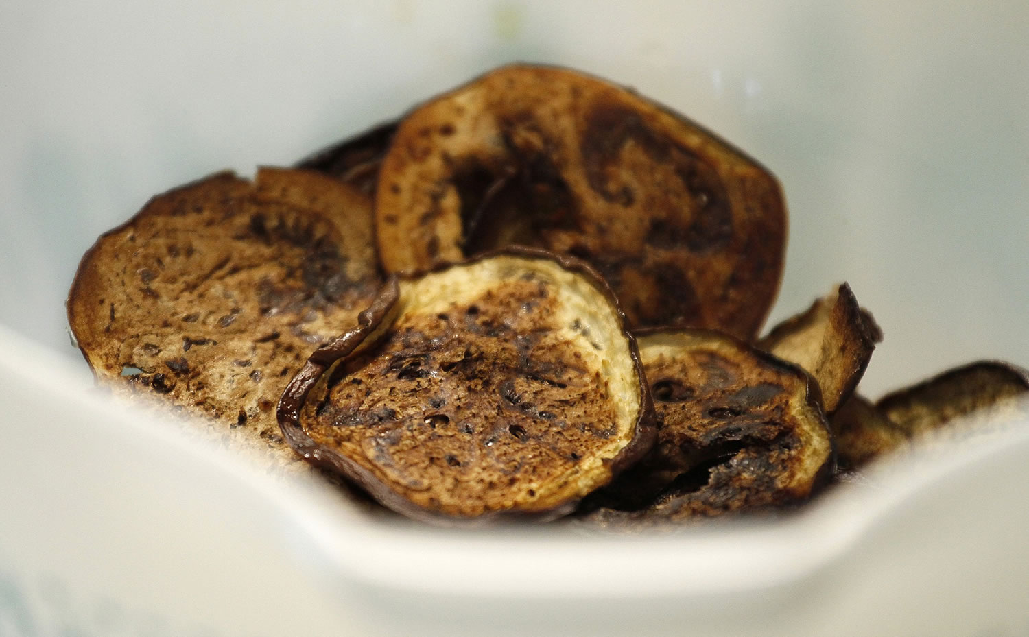 Baked eggplant chips adds crispiness to a rice bowl.