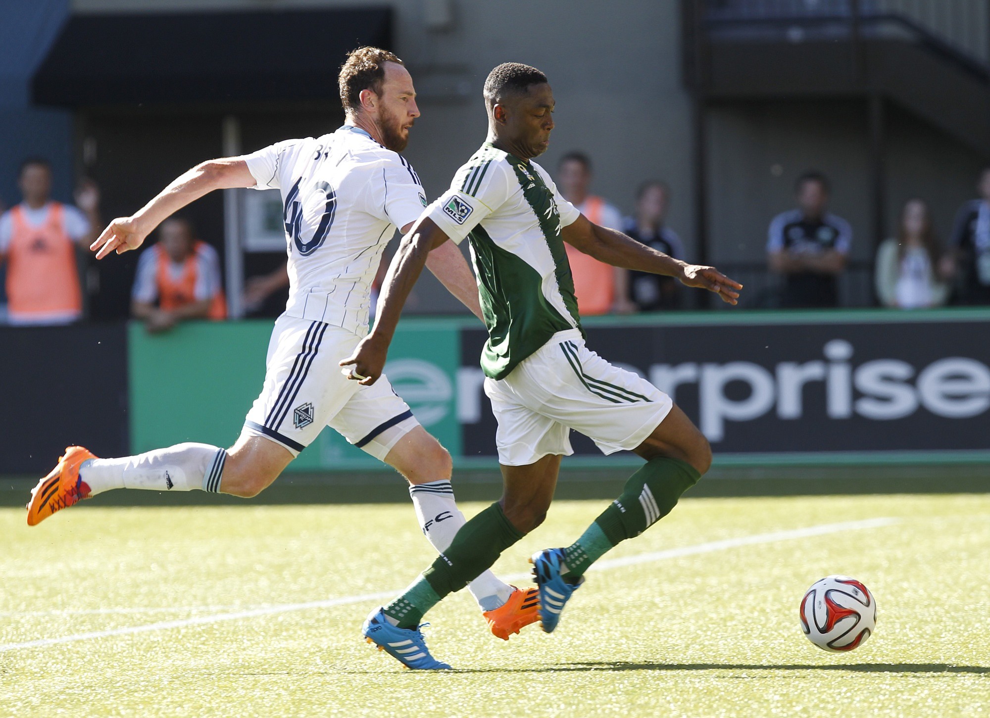 Portland Timbers forward Fanendo Adi (R) shoots during MLS soccer game between Portland Timbers and Vancouver (B.C.) Whitecaps.