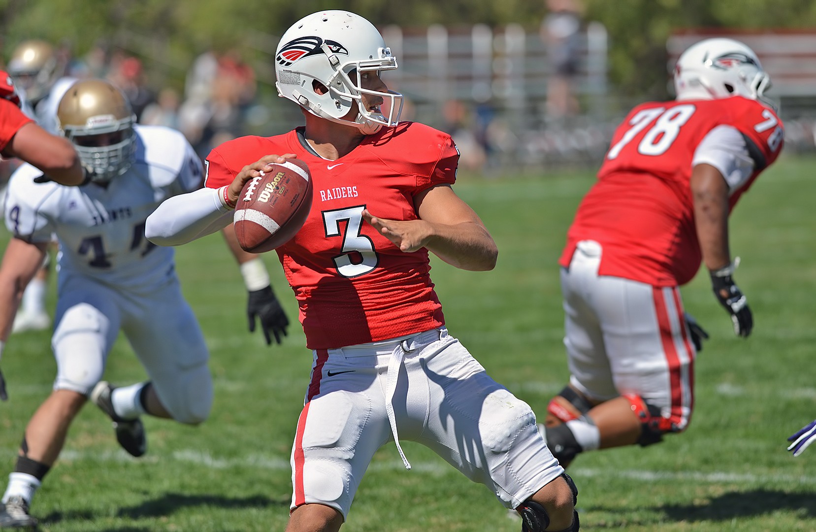 Southern Oregon University quarterback Austin Dodge (3) holds the NAIA all-time records for passing yardage and touchdown passes.