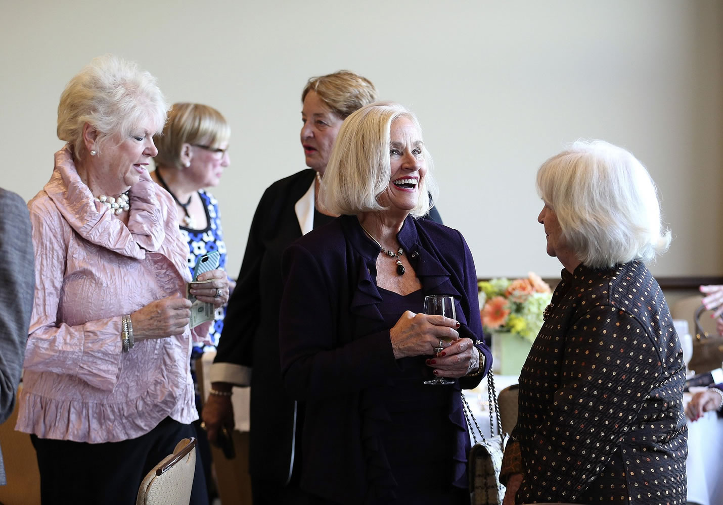 Members of Barat College's class of 1964, including Cathy Gibson, right, laughing with Lucy Naphin, far right, enjoy their 50th reunion Sept.