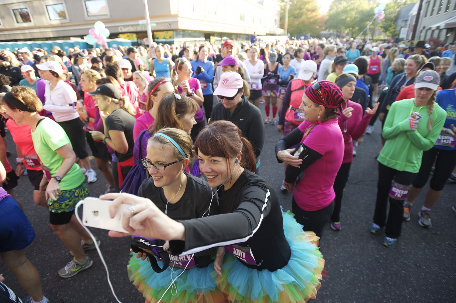 Runners prepare for the start of the seventh annual Girlfriends Half Marathon -- now named Girlfriends Run for a Cure -- on a chilly morning in October 2013.