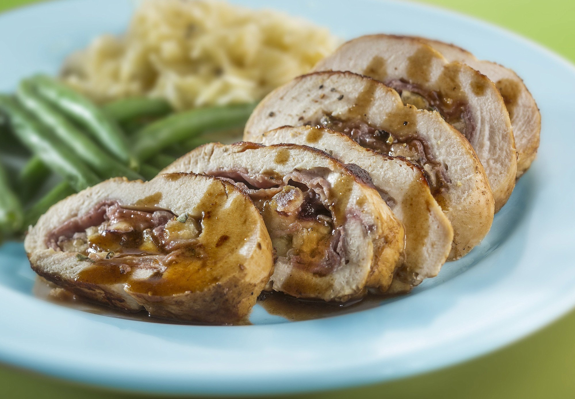 Fresh figs, prosciutto and Comte cheese fill a chicken breast, served with a simple pan sauce.