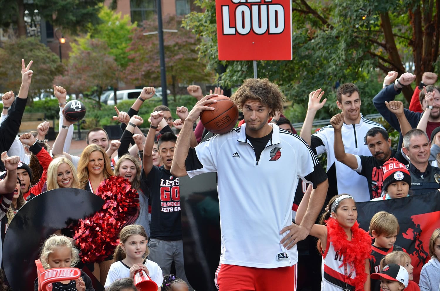 Portland Trail Blazers center Robin Lopez poses with fans while shooting a commercial in downtown Vancouver on Wednesday.