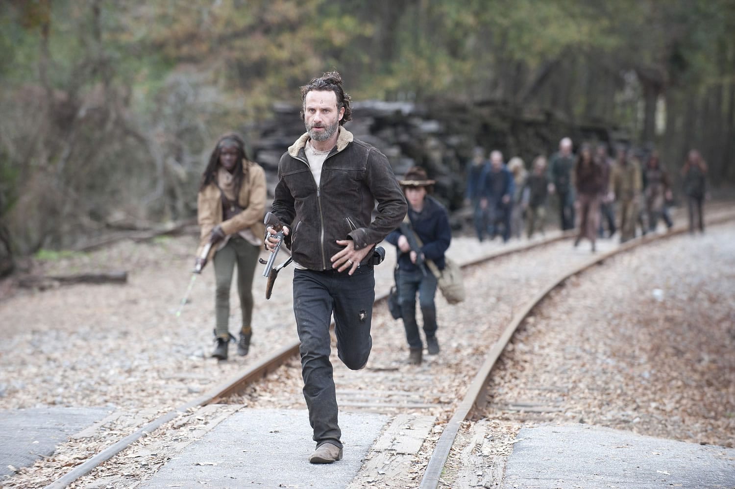 Michonne, from left, played by Danai Gurira, Rick Grimes, played by Andrew Lincoln, and Carl Grimes, played by Chandler Riggs, in a scene from AMC's hit series &quot;The Walking Dead.&quot;