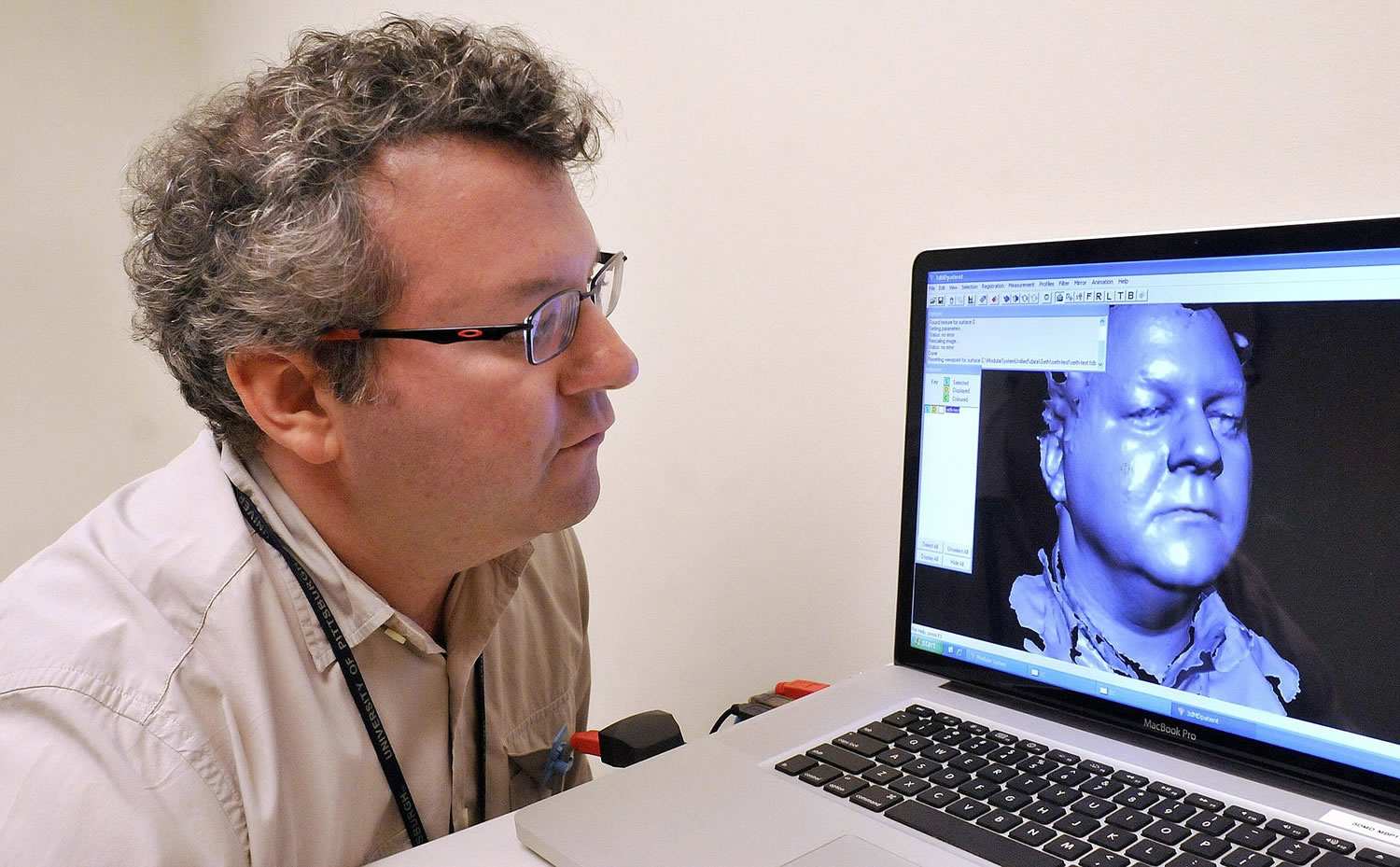 Seth Weinberg, assistant professor at the University of Pittsburgh School of Dental Medicine, looks at a three-dimensional image of his head.