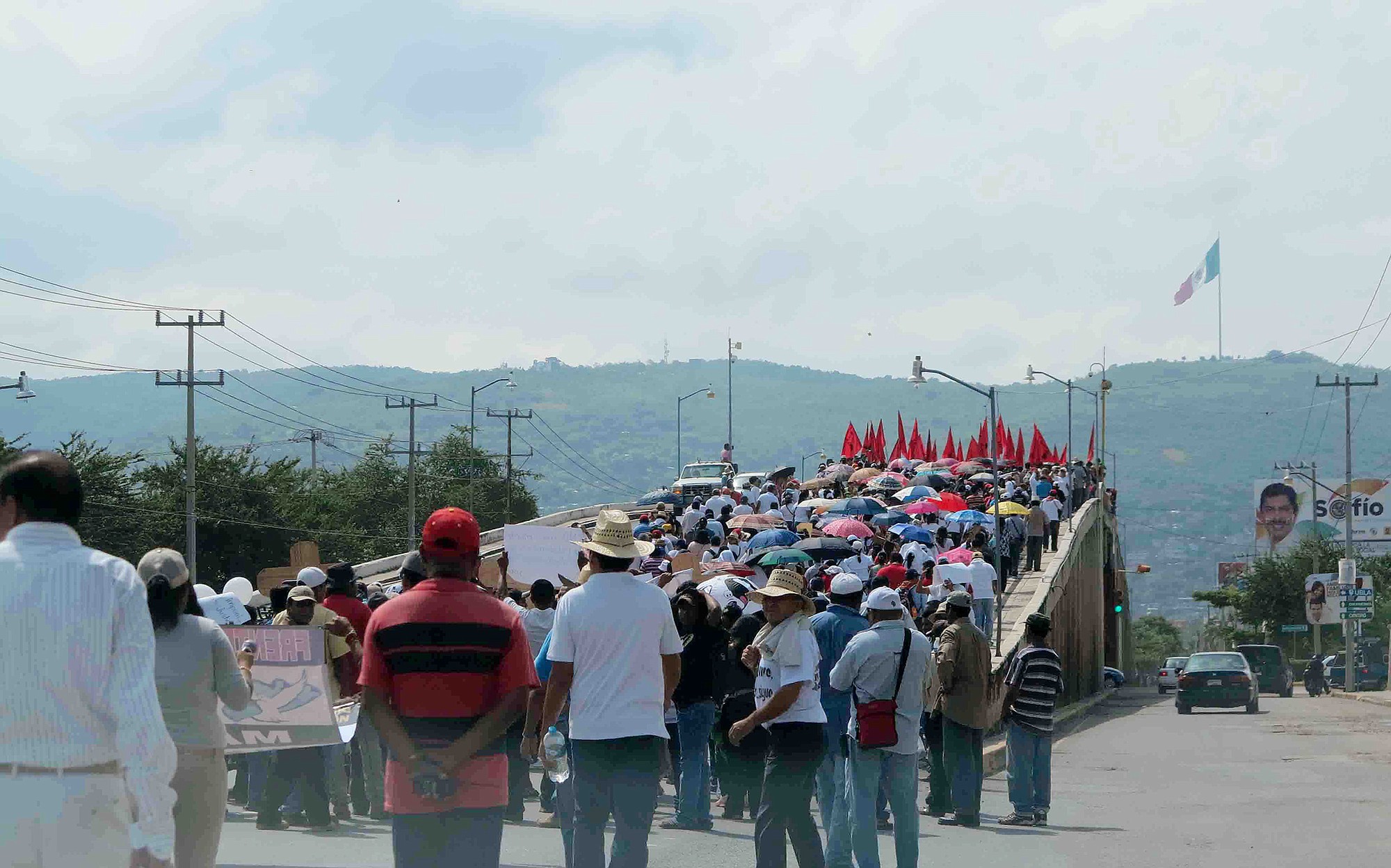 Thousands of protesters take to the main highway leading past Iguala, Mexico, on Wednesday.