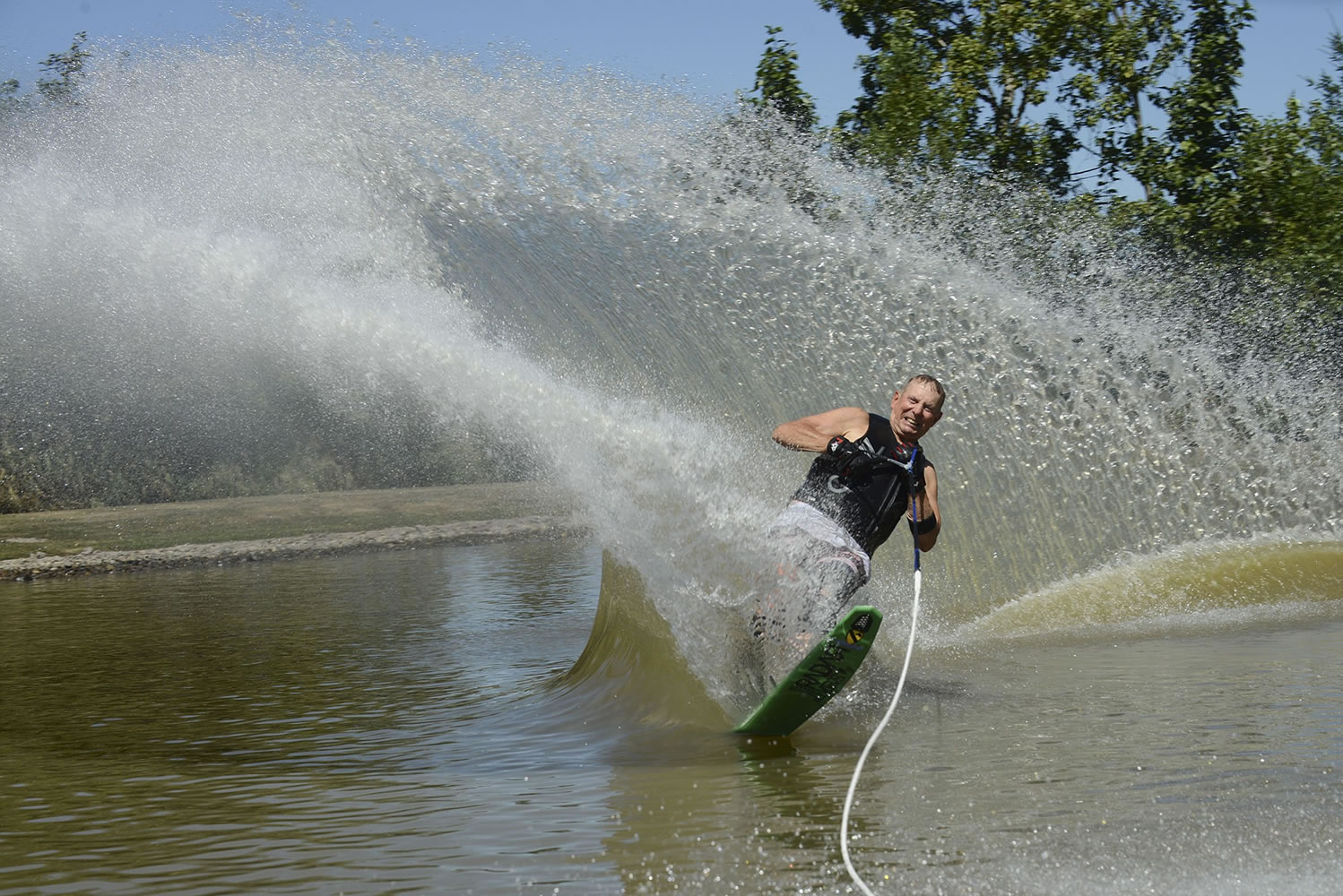 Scott Thompson and his daughter Erika Bolliger slalom water ski together on Mint Lake in Yacolt.