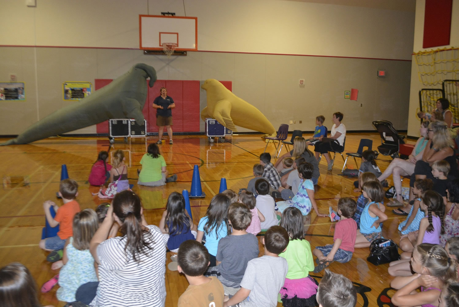 Washougal: Oregon Coast Aquarium staff members show kids and parents inflatable seals and sea lions during a visit Thursday to Hathaway Elementary School.