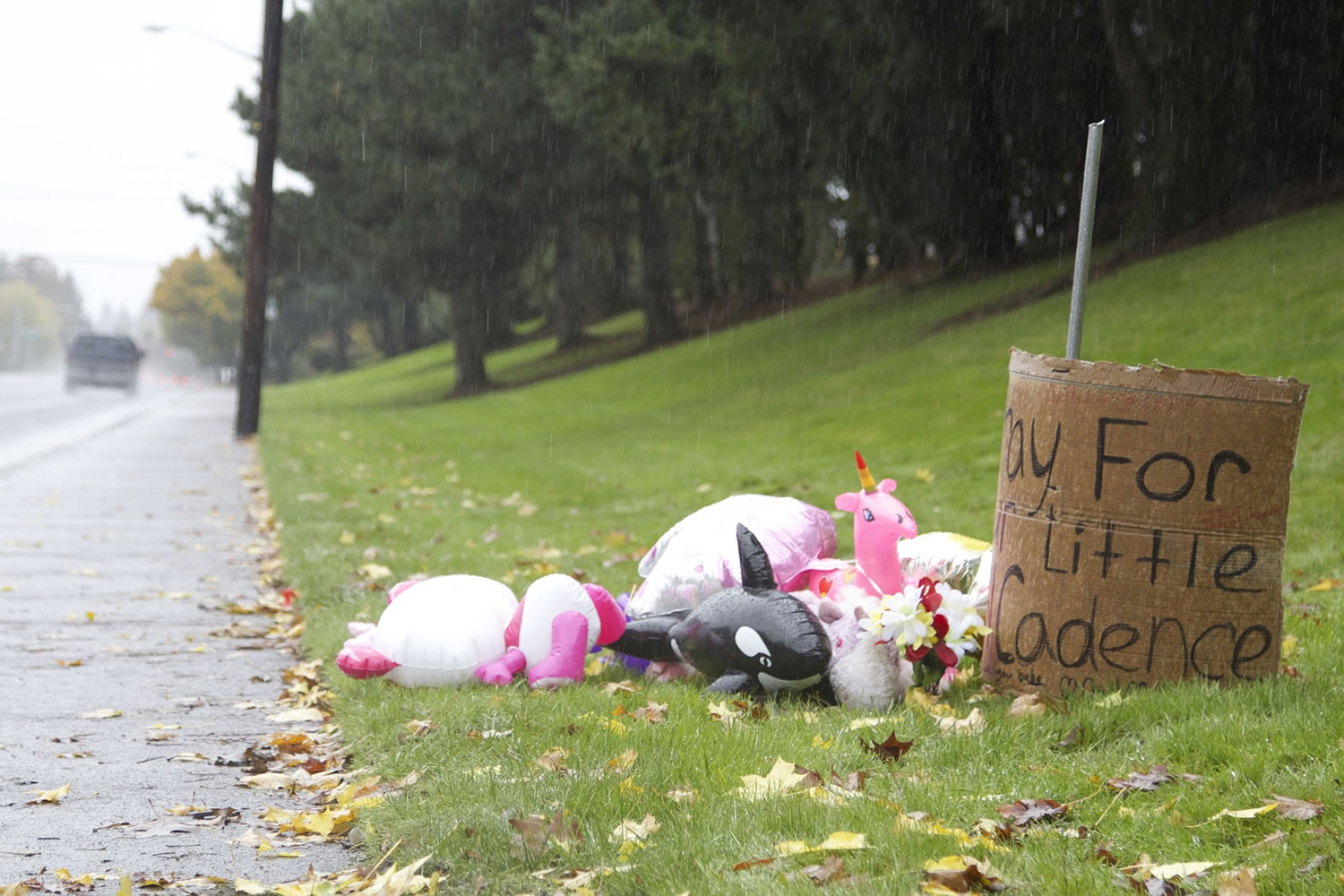 A roadside memorial along Northeast 112th Avenue in east Vancouver is seen on Sunday in the spot where four trick-or-treaters were struck by a car Friday evening.