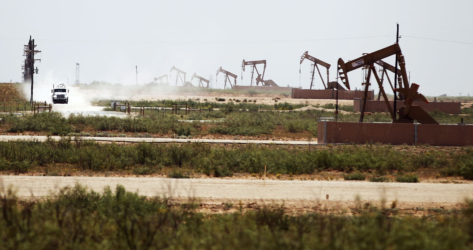 A line of oil pumps on land owned by Fasken Oil and Ranch near Midland, Texas, in late July.