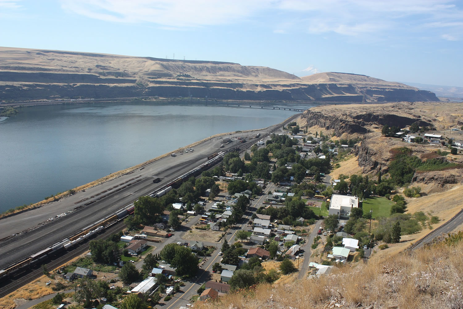The town of Wishram along the Columbia River, with the railroad bridge linking Oregon and Washington in the background.