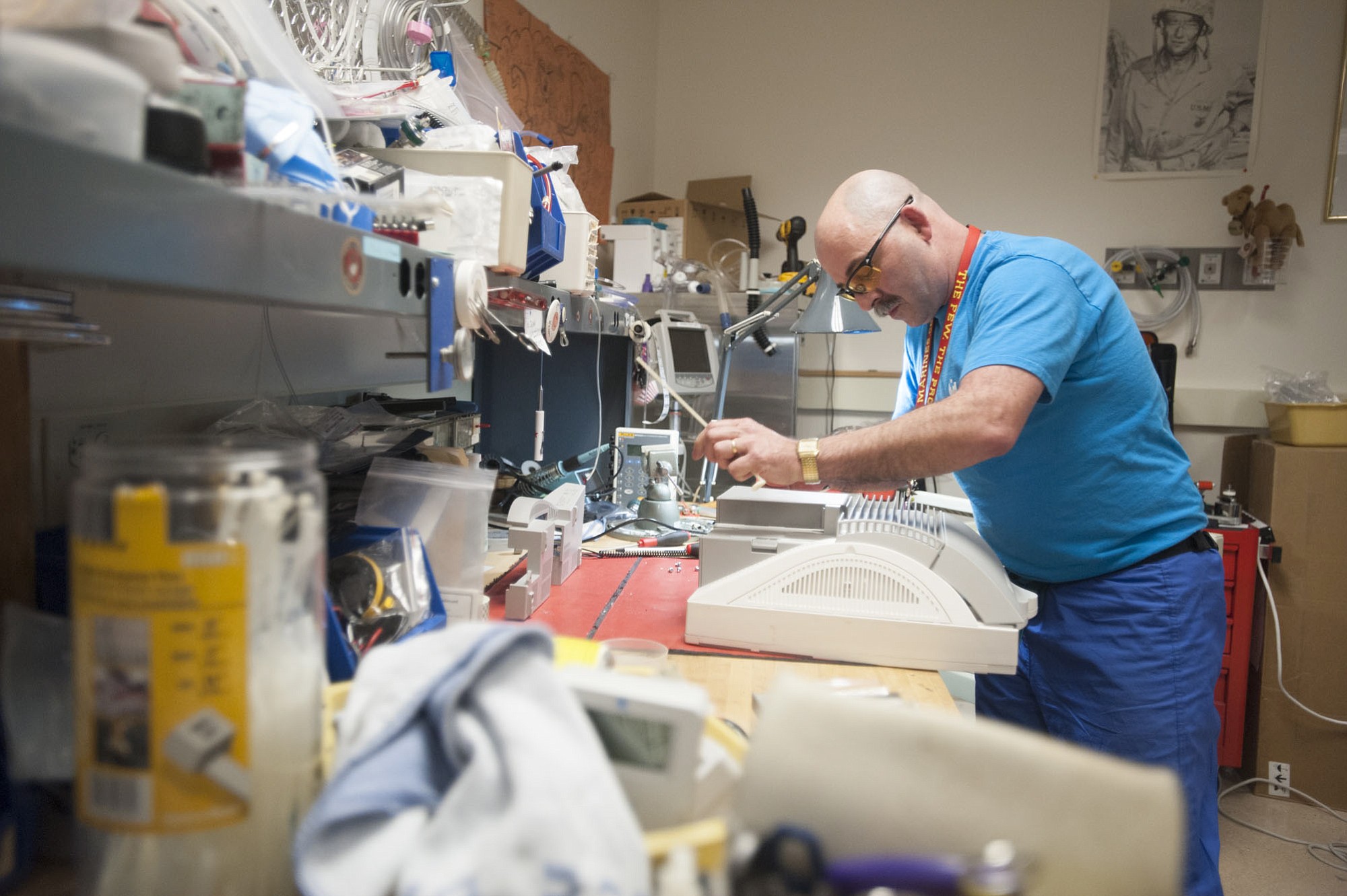 George Pobi, lead clinical engineering technician, works on a monitor Tuesday afternoon in his shop in the basement at Legacy Salmon Creek Medical Center.
