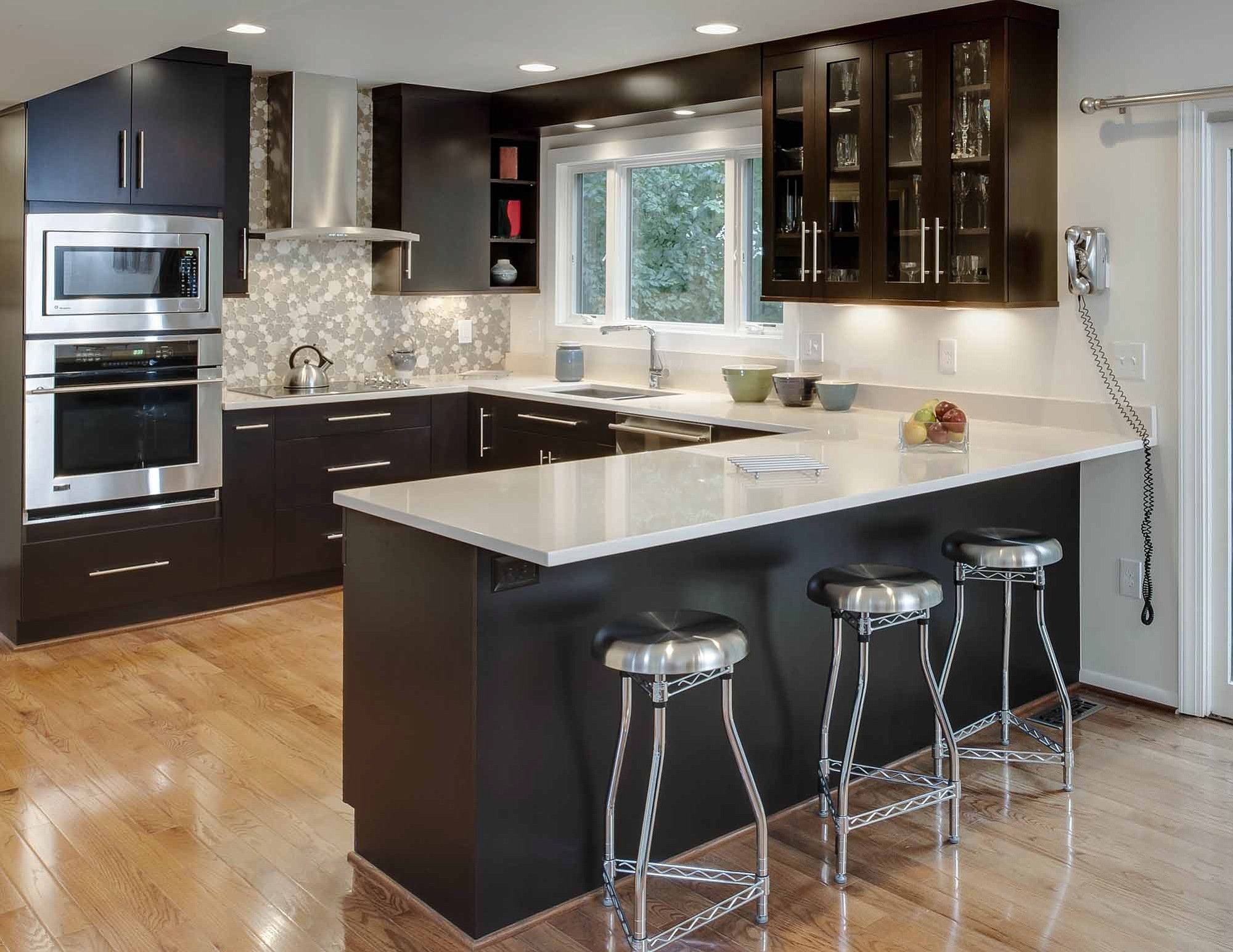 This kitchen designed by Kitchen Encoungers of Annapolis, Md., features maple cabinets painted ebony.