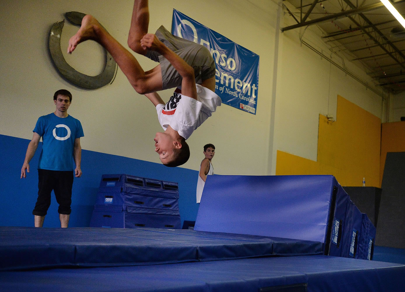Jacob Wells, 14, does a flip during a Parkour workout in August in Raleigh, N.C. Parkour is a holistic training discipline using movement that developed from military obstacle course training.