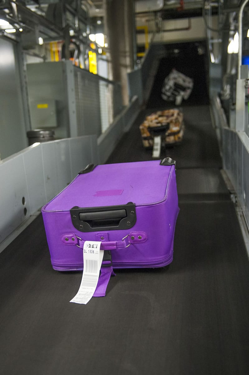 Most of the security checks of bags are done by machines as baggage moves along conveyor belts. Illustrates AIRLINES-LUGGAGE (category l), by Ashley Halsey III (c) 2014, The Washington Post. Moved Tuesday, Nov. 25, 2014.