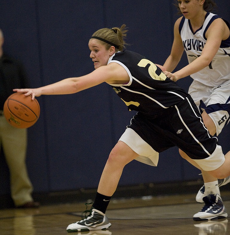 Evergreen's Justine Joudrey, #21, grabs a loose ball during a win against  Skyview 29-24 to win the District 4 Girls Basketball Championship at Skyview High School, Thursday, February 25, 2010.