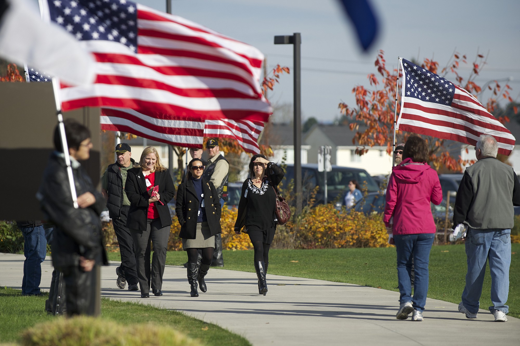 American flags lining the walkway greet people at the Armed Forces Reserve Center during 2013's Veterans Day Celebration.