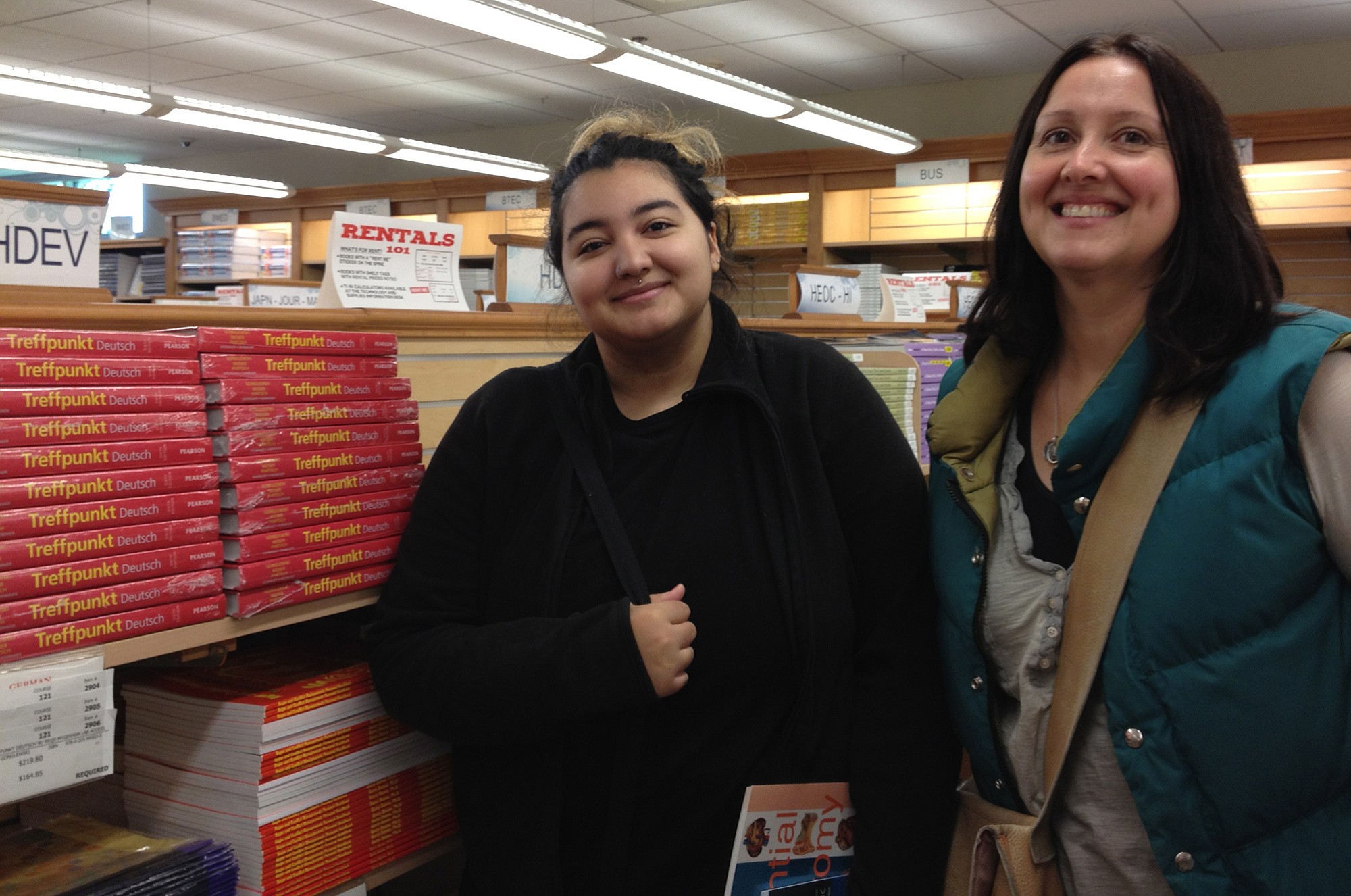 Jemma Gonzales,18, Clark College student and her mom, Brynn Gonzales check out textbook prices in the Clark College Bookstore. The textbook required for Jemma Gonzales' German class came with a hefty sticker price: $219.80. No used books remained on the shelf.