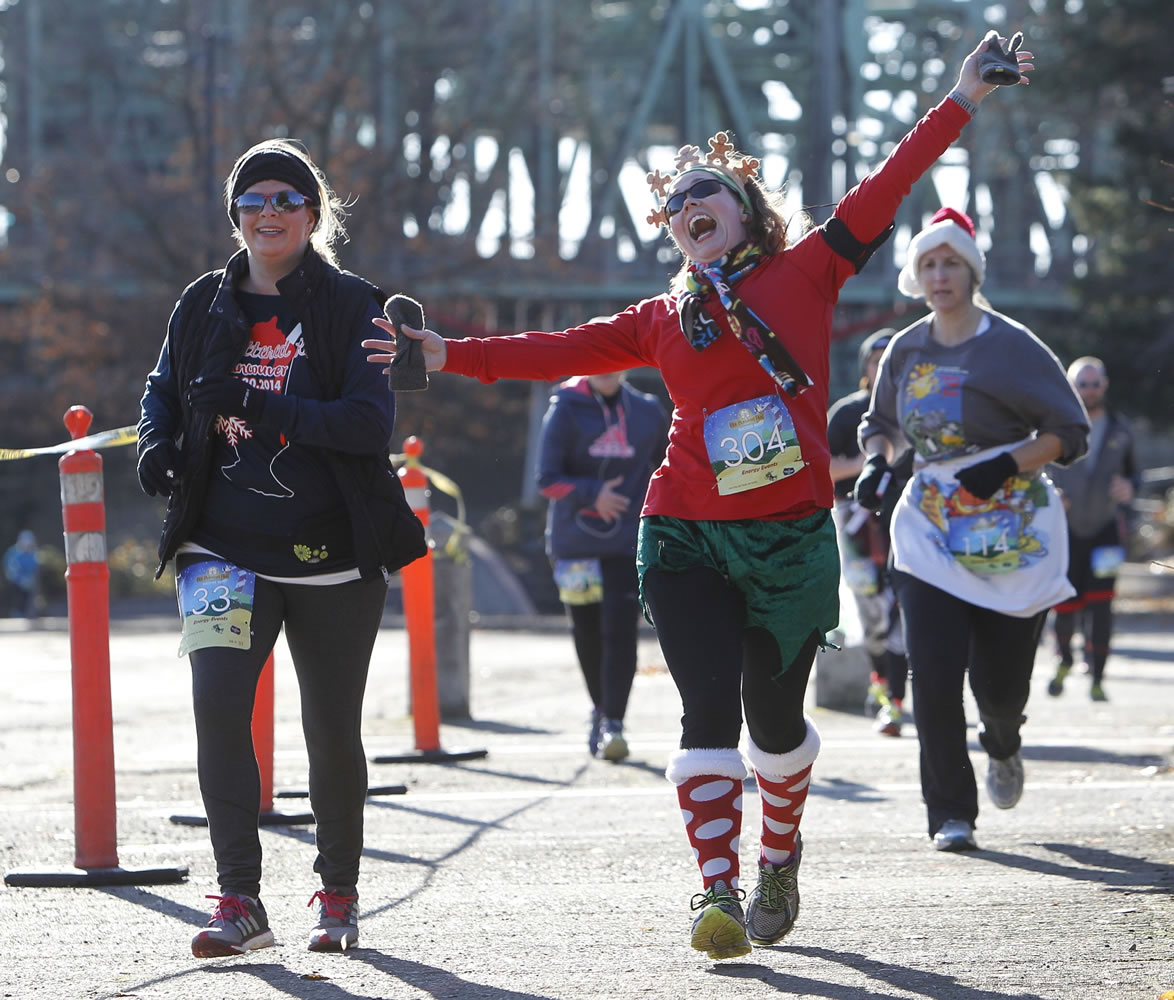 Participants of the fifth-annual Hot Buttered Run work off their Thanksgiving meal calories Sunday morning.