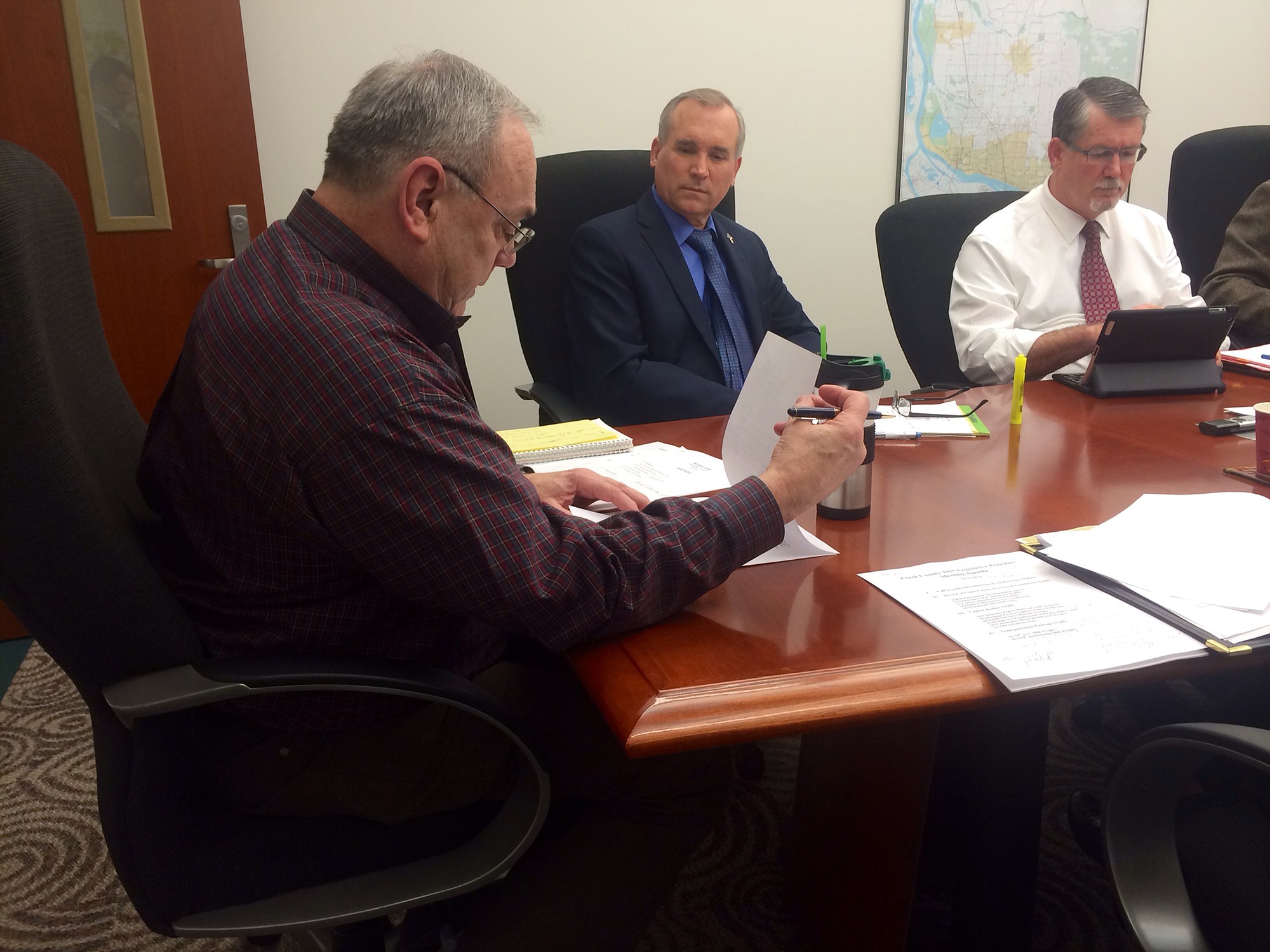 Clark County Administrator Mark McCauley, right, shown here in a file photo, accepted the job of county manager today under a contract approved by Commissioners Tom Mielke, left, David Madore, center, and Jeanne Stewart, not shown.