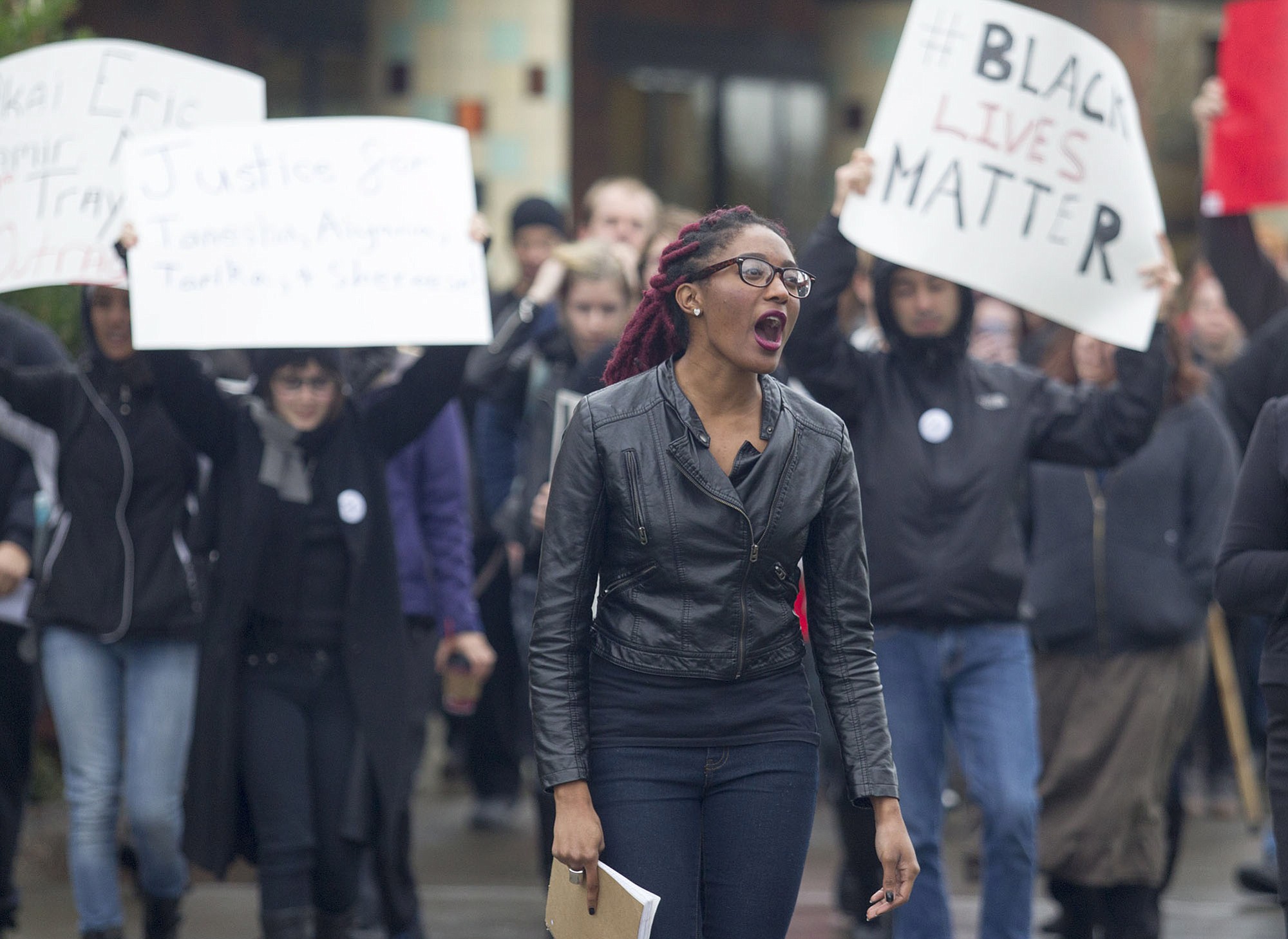 Student Cetara Davis leads a march held in response to the fatal police shooting of an unarmed black teen in Ferguson, Mo., and other similar cases around the nation on Wednesday at the Washington State Vancouver campus.