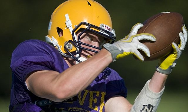 Columbia River's Kevin Cotter catches a pass while participating in a drill during practice at River on Tuesday August 24, 2010.