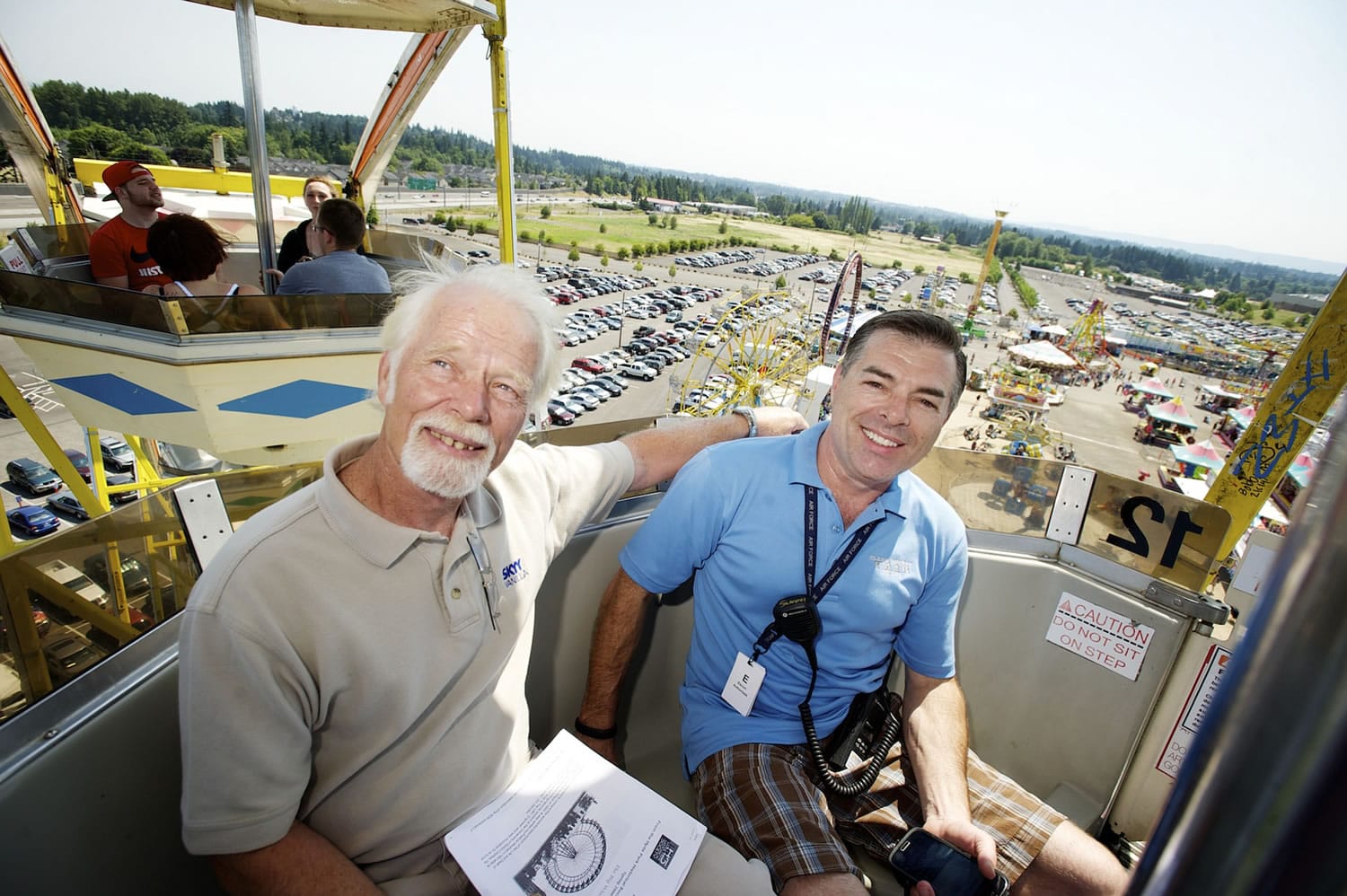William &quot;Skip&quot; Ferris, left, and his son Matt Ferris ride The Big Wheel at the Clark County Fair on Monday .