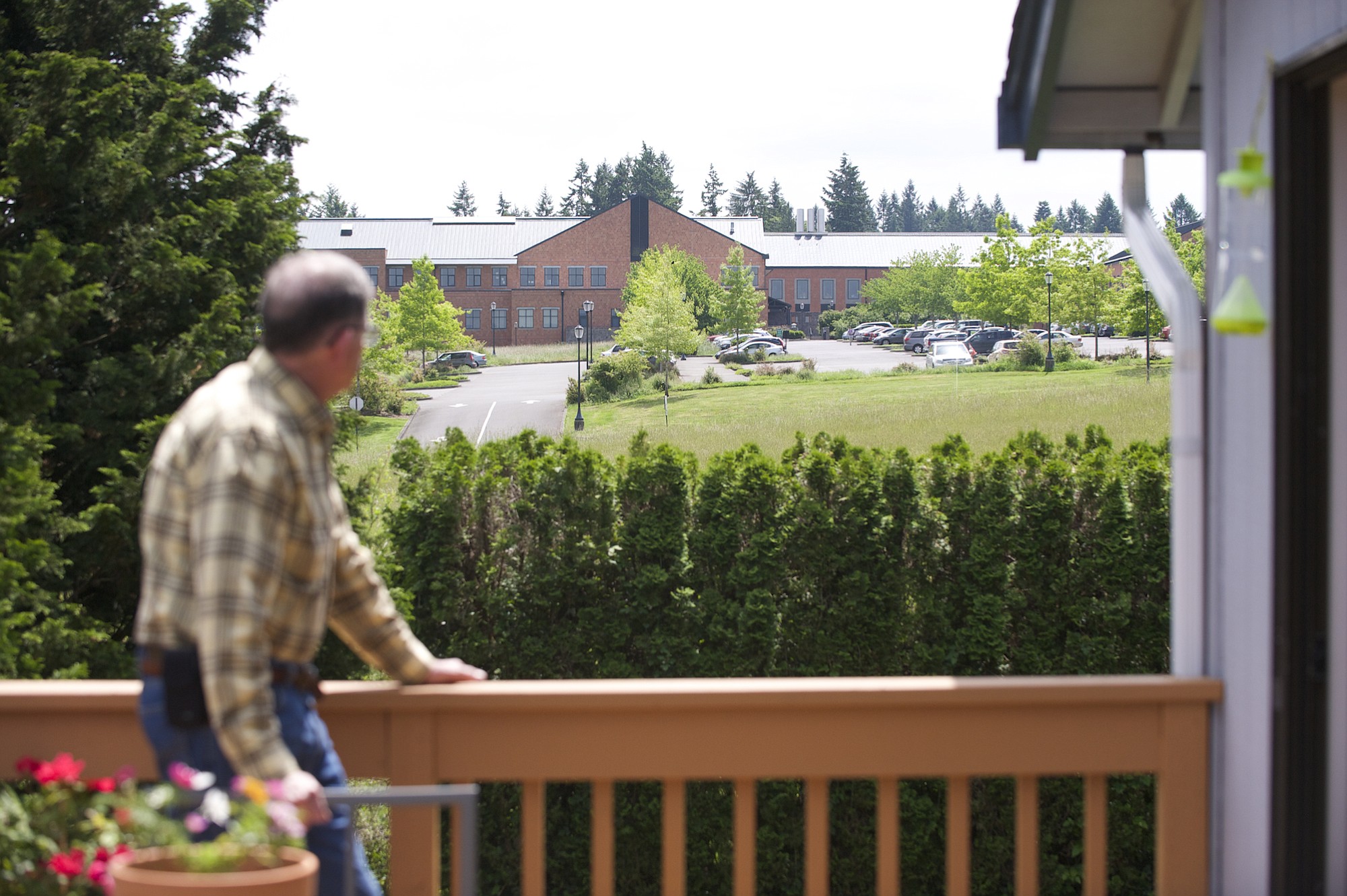 Tom Webster looks toward the Washington State University Vancouver campus from his deck in the Mount Vista neighborhood.