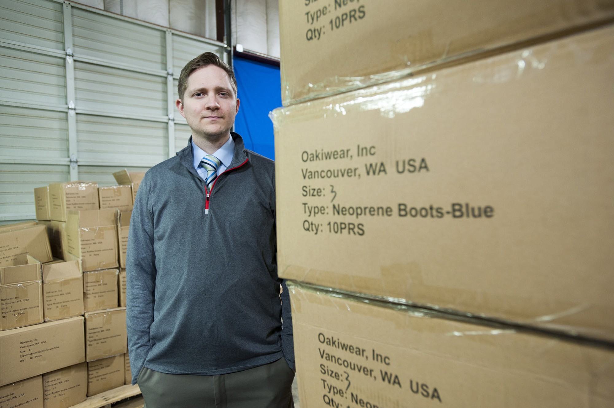 Ben Brewer, owner of Oakiwear, stands amid his inventory at his warehouse in Vancouver on Thursday.