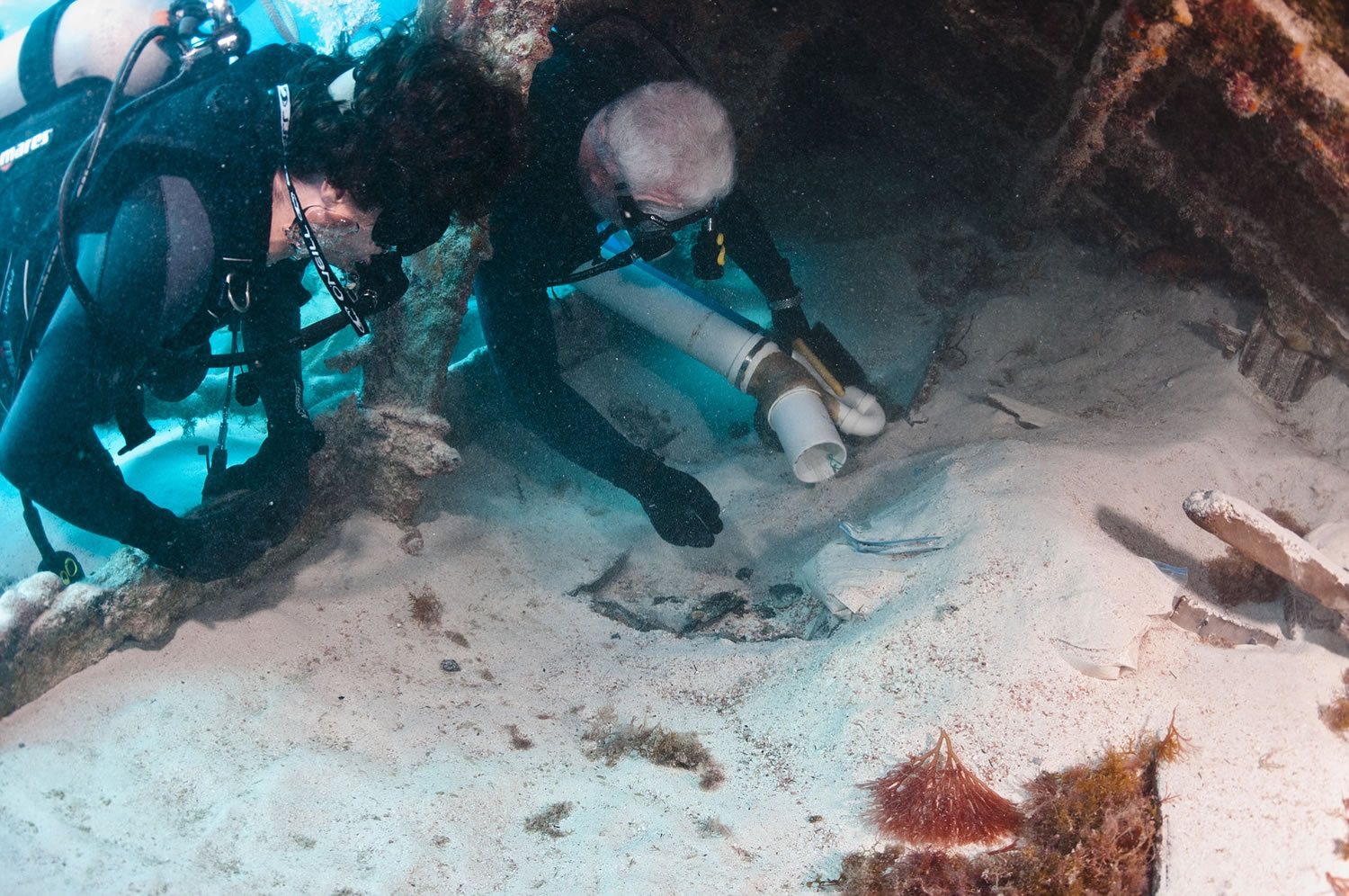 Courtesy of Jim Delgado
Philippe Rouja, left, and Jim Delgado clear sand from artifacts in the bow of the Mary Celestia. The Civil War blockade runner hit a reef just off Bermuda in 1864.