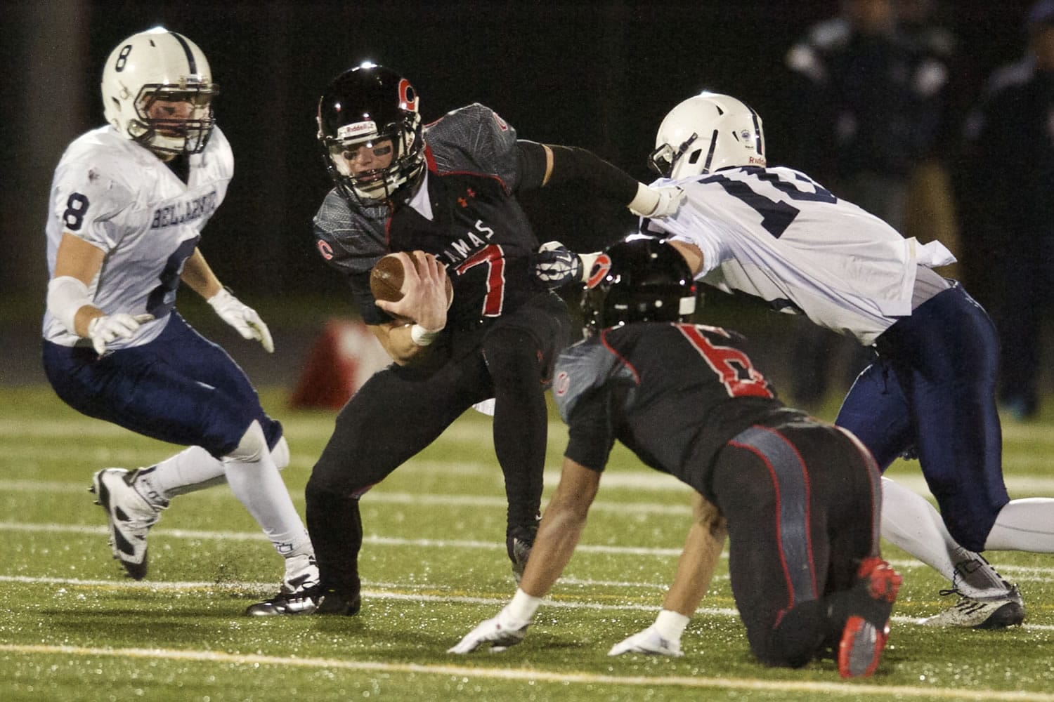 Camas quarterback Liam Fitzgerald (7) is taken down by the Bellarmine Prep defense Saturday in the Papermakers' loss in the opening round of the Class 4A football state playoffs.