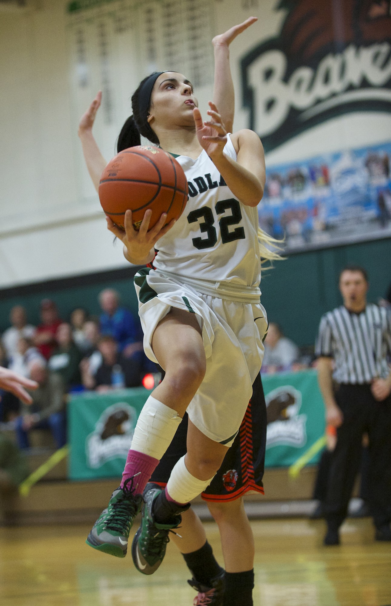 Woodland's Sidra Malik drives to the basket against Centralia in the 2A district playoff game on Friday.