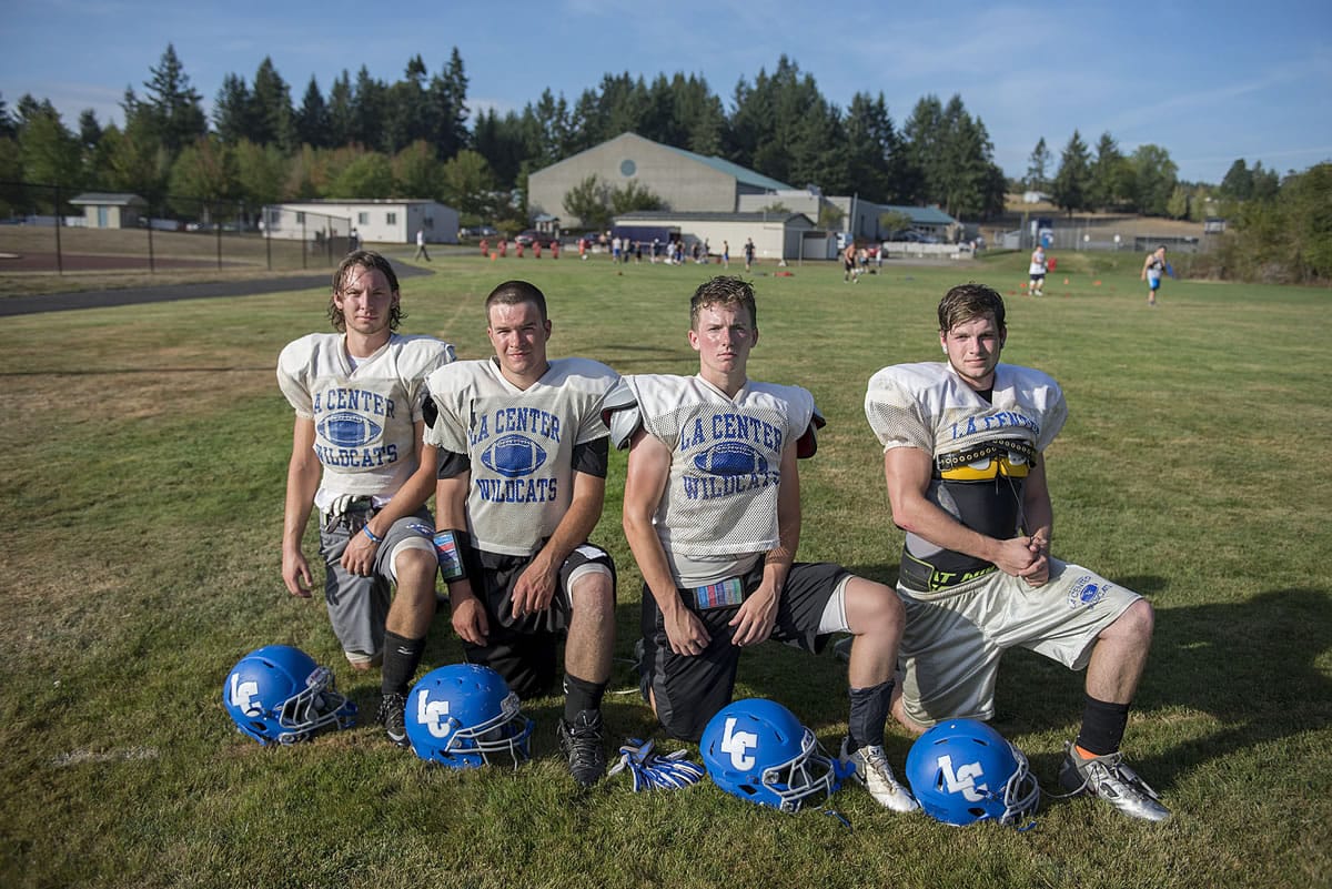 La Center's Dalton Morgan, from left, Michael Shufeldt, Zach Galster and Cole Judd are pictured at their team's practice field after practice Thursday evening, August 27, 2015.