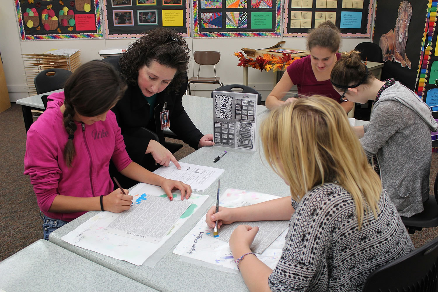 Brush Prairie: Laurin Middle School art teacher Tanya Bachman, who was recently awarded &quot;Middle Level Educator of the Year&quot; from the Washington Art Education Association, helps students with an art project.