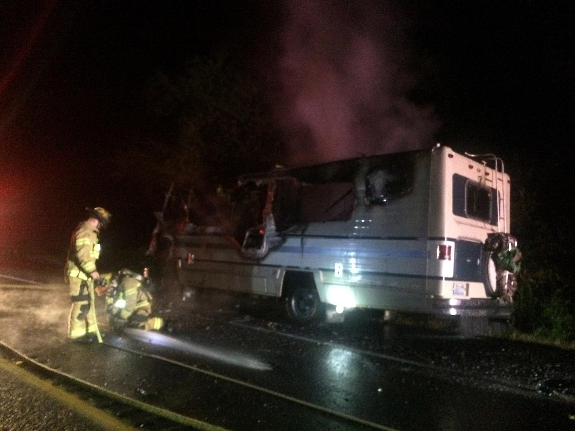 Dan Yager/Clark County Fire 
Firefighters put out a blaze late Monday night in a motor home on state Highway 503 near Northeast 321st Street. The recreational vehicle was reported as a total loss.