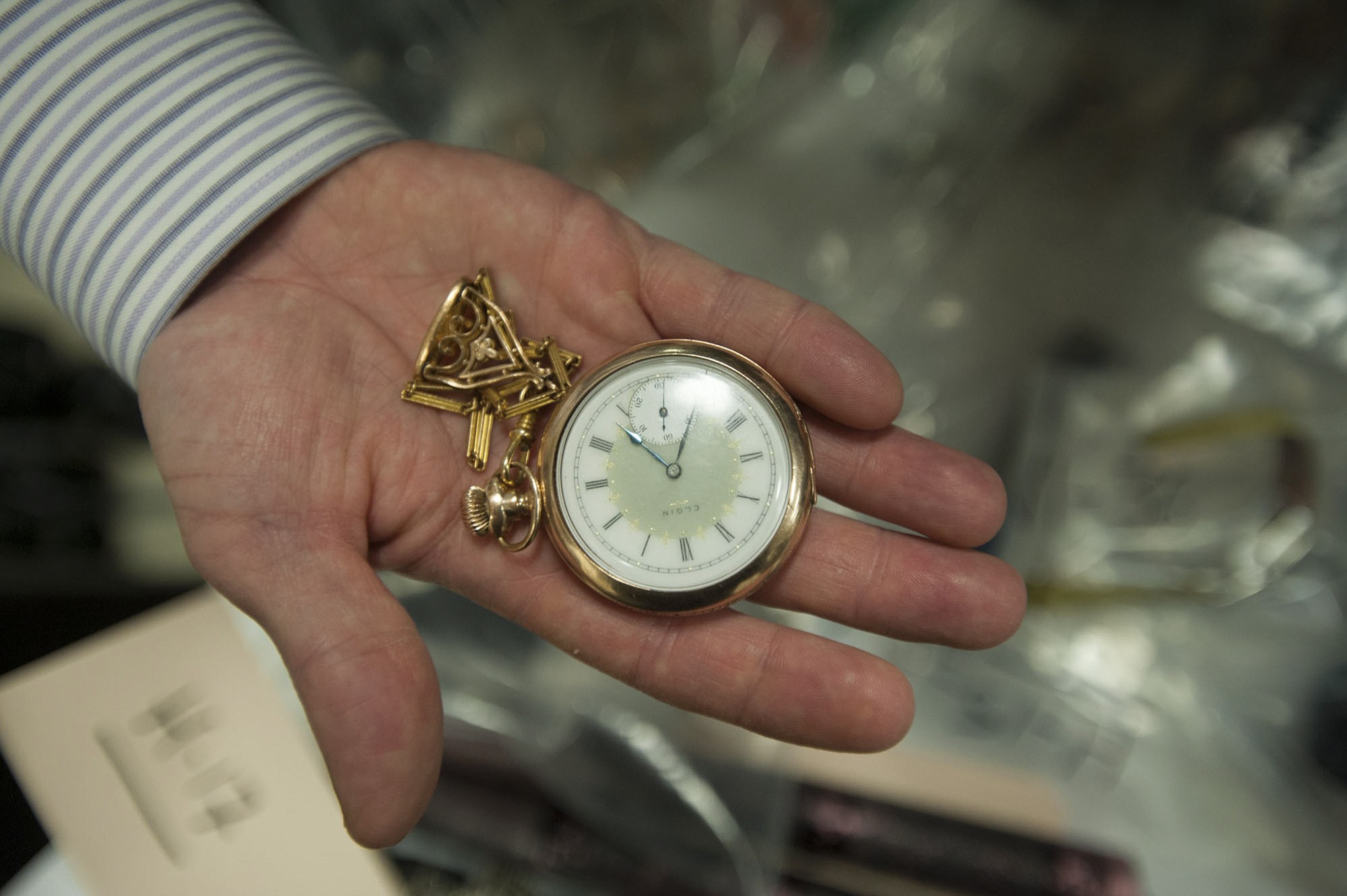 Ed Garrow holds a pocket watch that was stolen from his house in February.