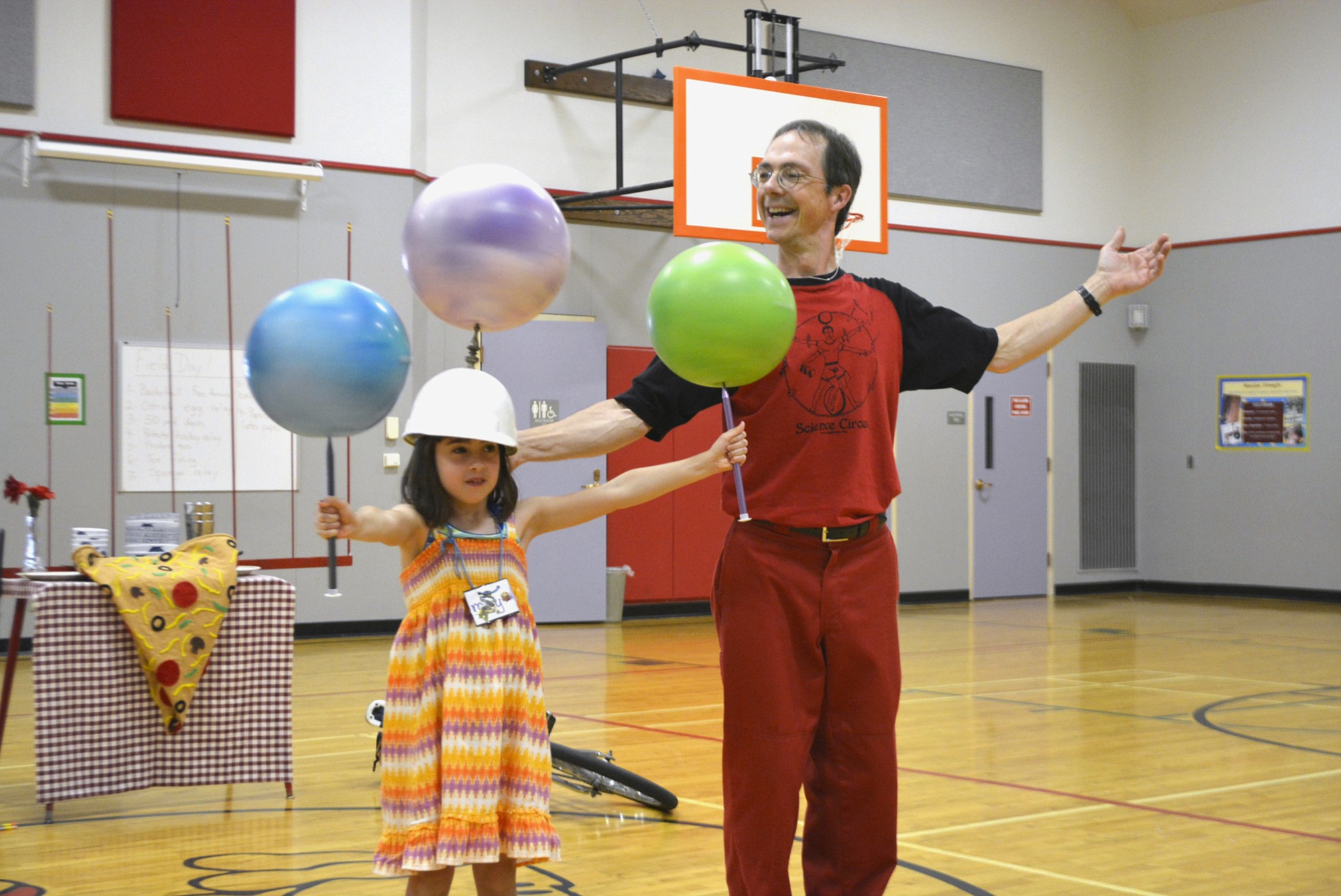 Washougal: Maya Hopkins, left, and Jugglemaniac Rhys Thomas put the law of gravity to the test on June 7.