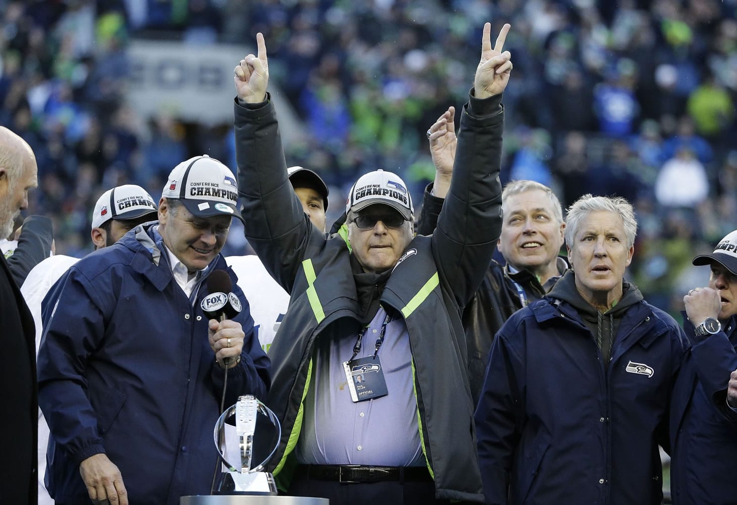 Seattle Seahawks owner Paul Allen celebrates after the NFC Championship game against the Green Bay Packers Sunday, Jan. 18, 2015, in Seattle.