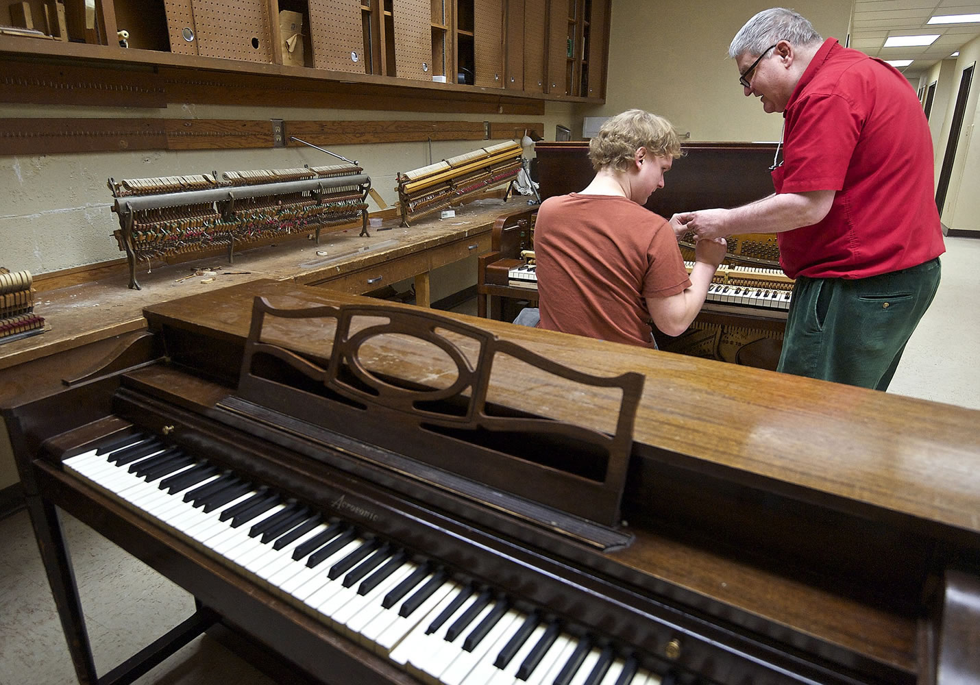 Don Mitchell works with student Stefan Kincaid, 25, of Sennett, N.Y.