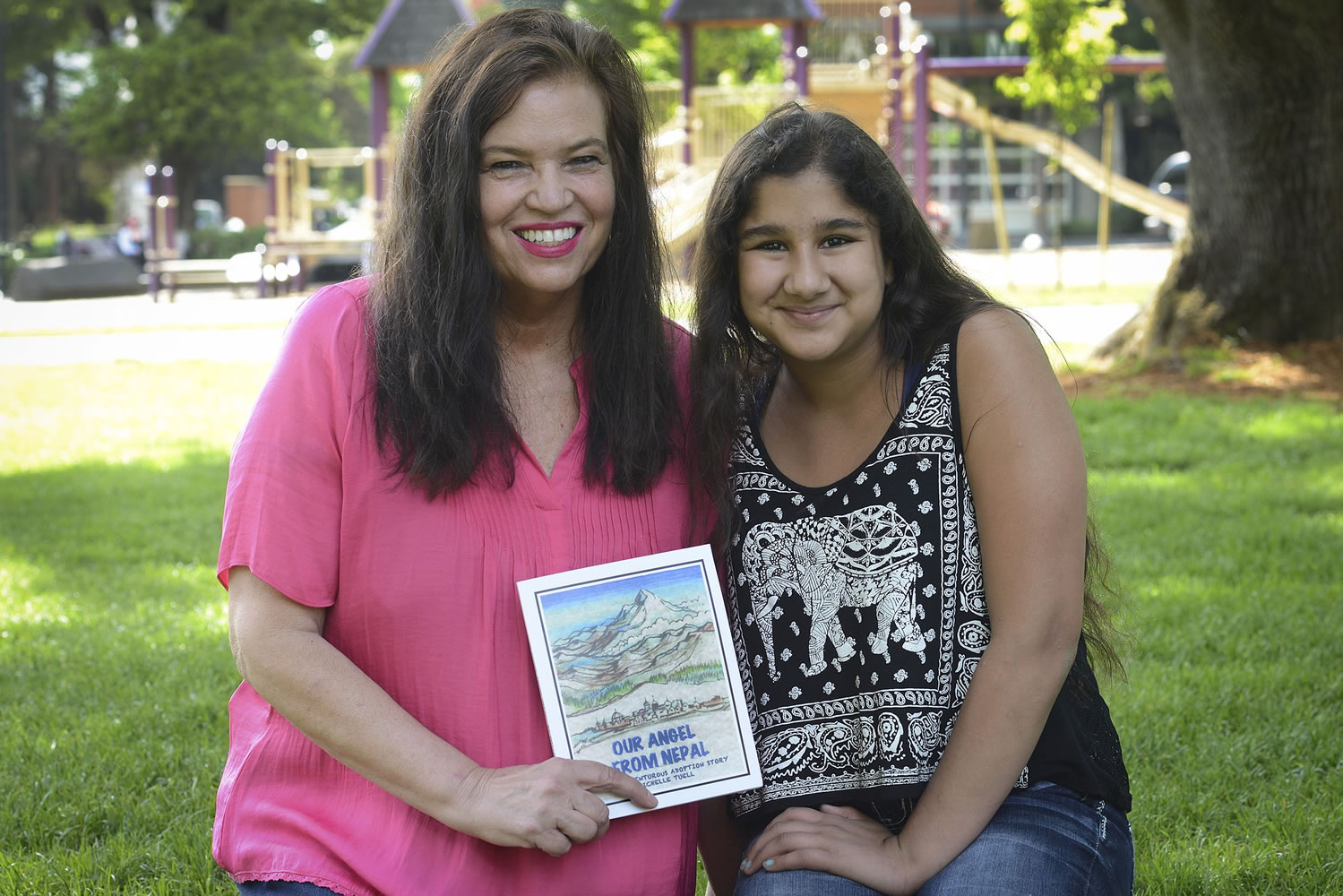 Ariane Kunze/The Columbian
Michelle Tuell, left, recently published a book about adopting her daughter, Maya Tuell, 12, from Nepal. The two are collecting donations for Maya's former orphanage in the wake of the recent earthquakes in Nepal.
