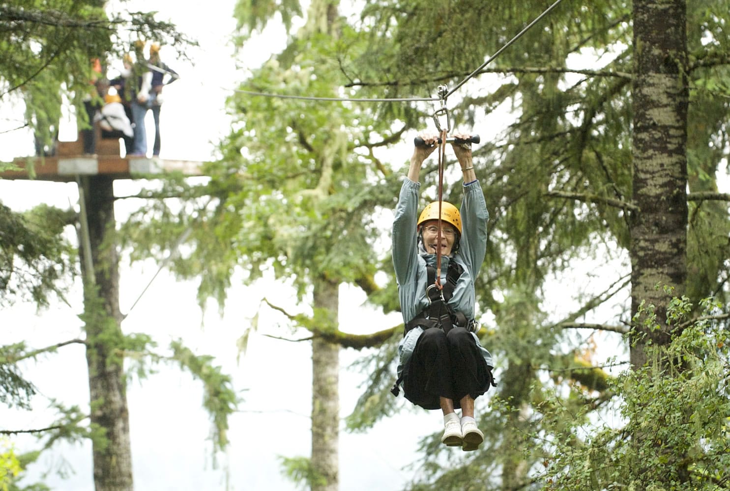 Photos by Steven Lane/The Columbian
Levina Strain, 95, rides a zip line at Tree to Tree Aerial Adventure Park in Gaston, Ore., in late September. But Strain said her real bucket-list wish is to visit her childhood home again.