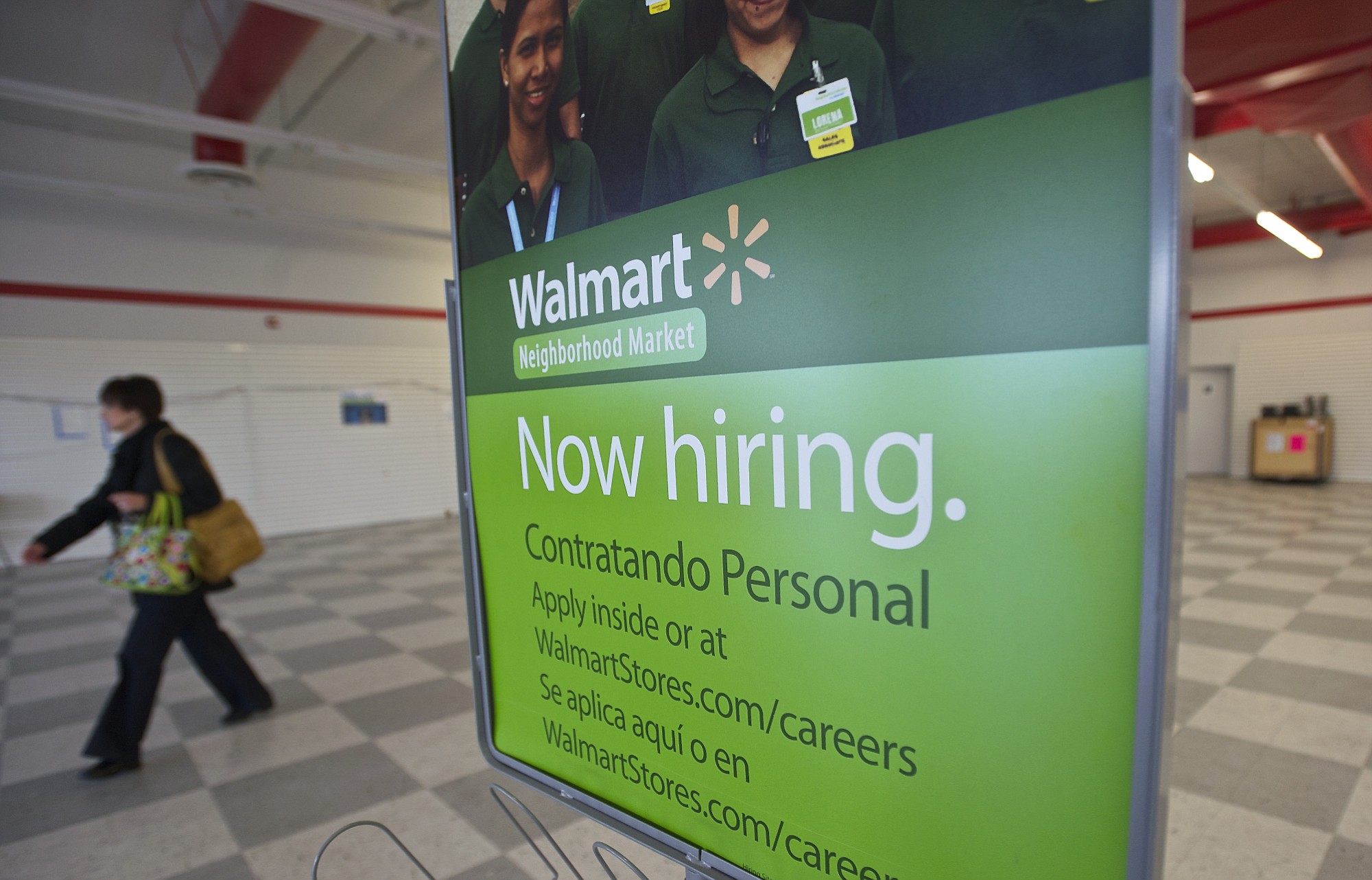 Prospective employees fill out applications and meet with Wal-Mart managers this spring as the giant retailer planned to open two stores in Clark County.