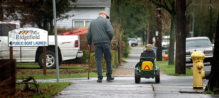 Terry Gross and his 5 year-old grandson Colin Gross go for a morning walk in downtown Ridgefield.